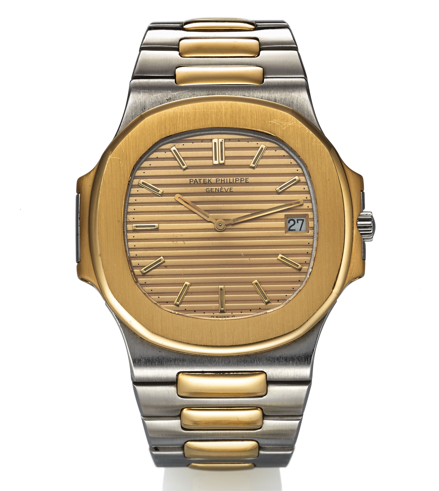 PATEK PHILIPPE REF. 3700/11 JUMBO NAUTILUS STEEL AND GOLD 
Patek Philippe, Genève, "Nautilus," movement No. 1308381, case No. 558802, 
Ref. 3700/11. Made circa 1982. 
Very fine and rare, cushion-shaped, self-winding, water resistant, 18K yellow gold and 
stainless steel wristwatch with date and an 18K yellow gold and stainless steel Patek 
Philippe "Nautilus" bracelet with deployant clasp. Accompanied by 2 spare links..