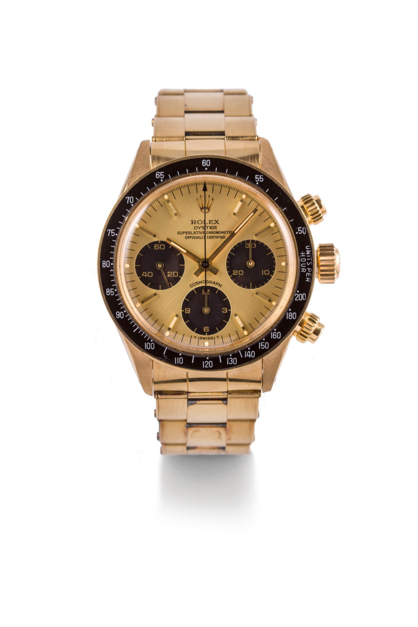 ROLEX, DAYTONA CHRONOGRAPH, REF. 6263, YELLOW GOLD 
Rolex, Oyster Cosmograph Daytona, case No. 7426643, Ref. 6263. Madecirca 1982. 
Fine and rare 18k yellow manual winding chronograph wristwatch with aRolex 18k yellow gold bracelet. Box and Papers 
Rare et belle montre bracelet chronographe en or jaune 18k. Boitier rond.
Fond visse. Lunette fixe tachymetrique. Cadran champagne et noir avec appliques 
baton en or jaune, totalisateurs pour les secondes, minutes et heures.
Aiguilles en or jau