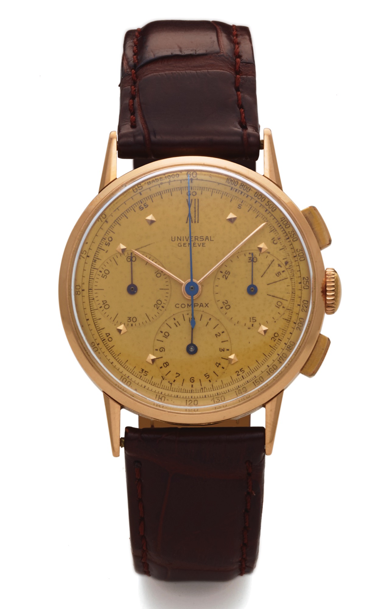 UNIVERSAL REF 12514 COMPAX PINK GOLD 
Universal, Geneve, "Compax Chronograph", Ref. 12514. 
Made in the 1950s. 
Fine 18K pink gold wristwatch with square button 
chronograph, registers and tachometer.