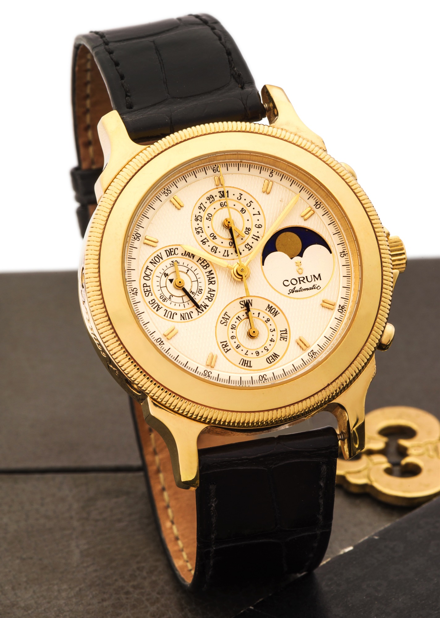 CORUM PERPETUAL TEMPS 
MECHANIQUE NO. 33/100 YELLOW GOLD
Corum, case No. 463736, Ref. 83.111.56. No. 33/100 A. Made in a 
limited edition of 100 pieces in the early 1990s. 
Very fine, astronomic, self-winding, water-resistant, 18k yellow 
gold wristwatch with round button chronograph, registers, 
perpetual calendar and moon phases and 18k gold Corum 
buckle. Accompanied by a Corum box, blank warranty certificate 
and an overhaul paper from Corum dated 2010.