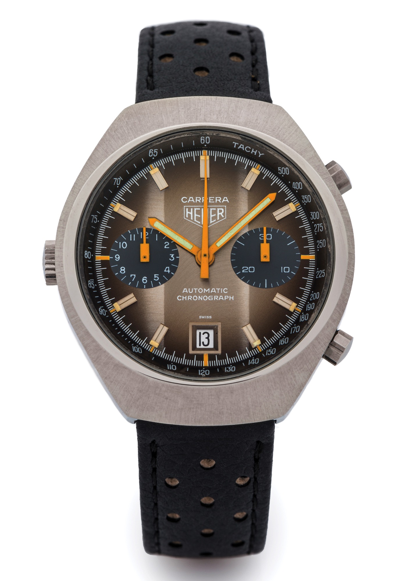 HEUER REF. 110573 CARRERA STEEL
Heuer, Carrera, Automatic Chronograph, case No. 323390, Ref. 110573 B. Made in 1974. 
Fine, self-winding, water-resistant, tonneau-shaped, stainless steel left-handed wristwatch with 
round button chronograph, register, tachometer and date and a Heuer strap with stainless steel 
buckle.