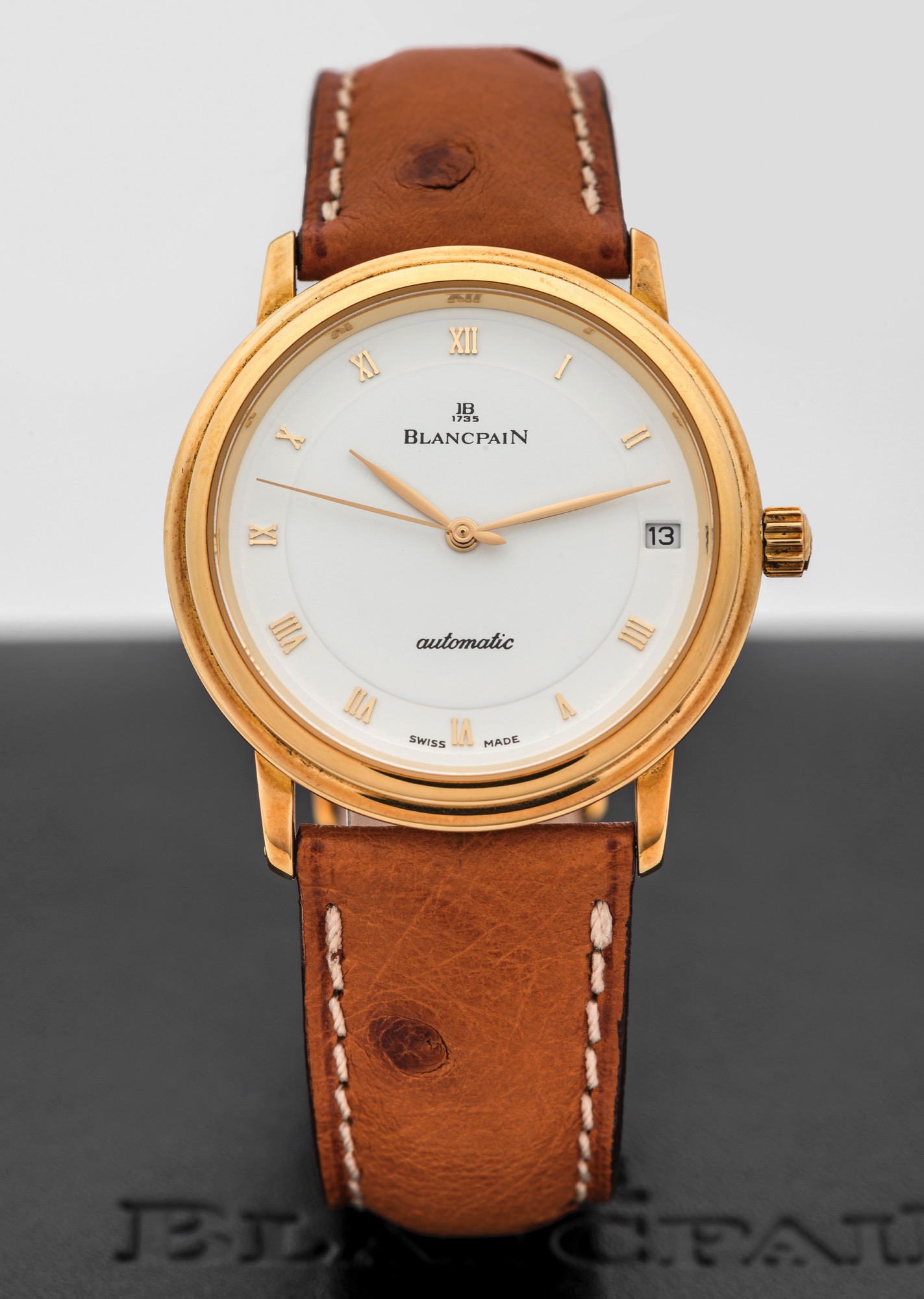 BLANCPAIN VILLERET AUTOMATIC YELLOW GOLD 
Blancpain, "Villeret", No. 344, Ref. 1151 1418 55. Made circa 2000s. 
Fine and elegant, automatic, center-second, 18K yellow gold 
wristwatch with date and an 18K yellow gold Blancpain buckle. 
Accompanied by a fitted box, guarantee, and instruction booklet.