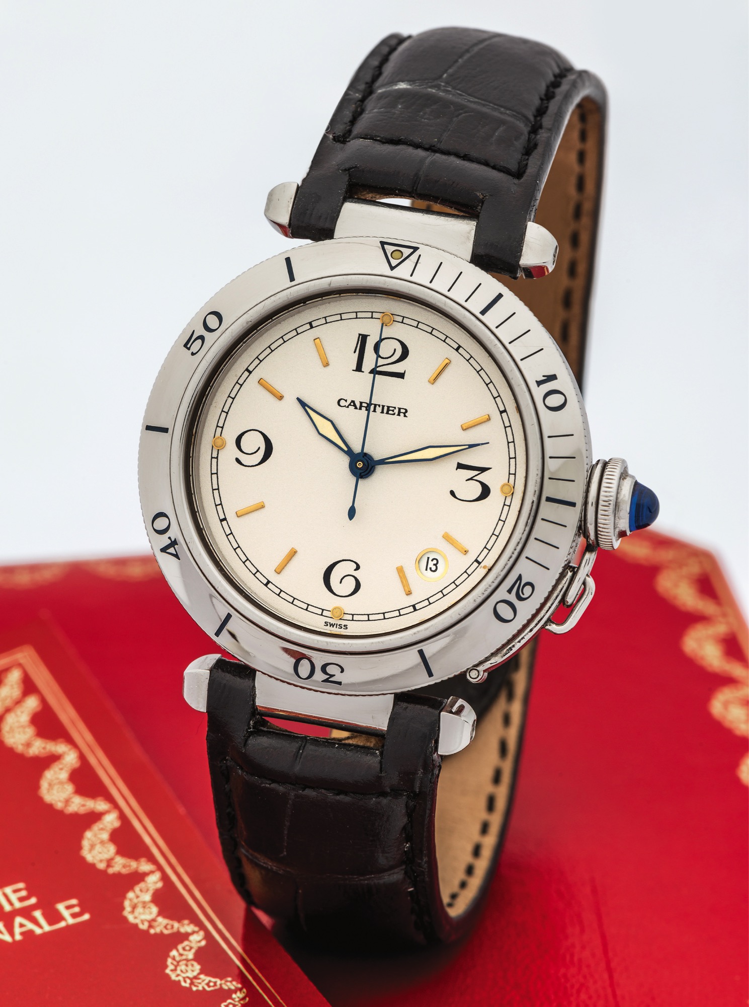 CARTIER REF. 2324 PASHA AUTOMATIC STEEL 
Cartier, Pasha - Automatic, case No. R40208492, Ref. 10401. Made circa 2005. 
Fine, center seconds, self-winding, water-resistant, 
stainless steel wristwatch with date and a stainless steel 
Cartier deployant clasp. Accompanied by a fitted box and blank international warranty certificate