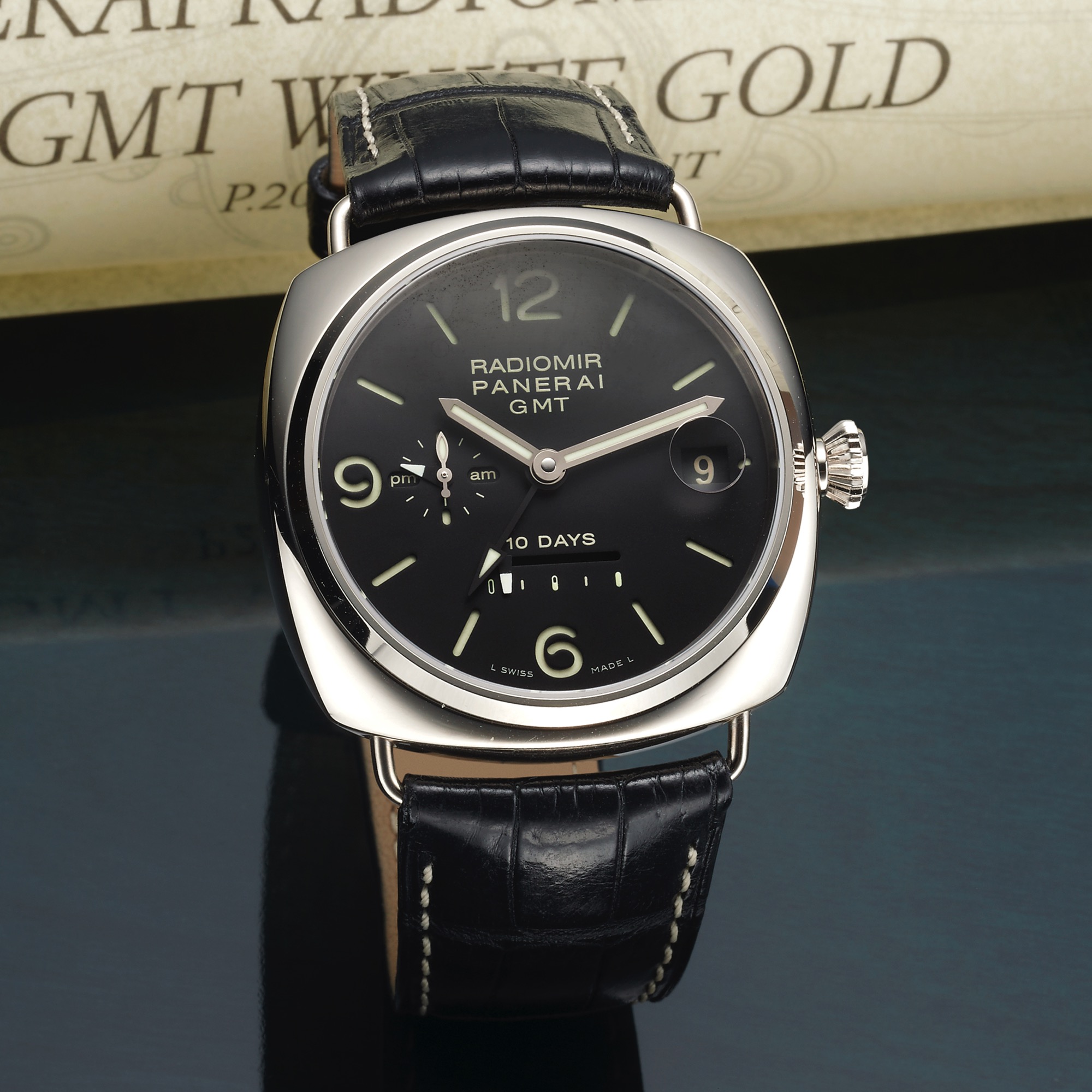 PANERAI PAM 00235 REF. 6661 10 DAYS GMT WHITE GOLD 
Officine Panerai, Firenze 1860, "Radiomir 10 Days GMT," PAM 235, Ref. OP 6661, case No. BB 1208461, 
limited No. J 037 / 250. Made in a limited edition of 250 examples in 2007. 
Very fine and rare, large, cushion-shaped, water-resistant, two-time zone, self-winding, 18K white gold 
wristwatch with date, 10 days power reserve, 24 hour indication and an 18K white gold Panerai double 
deployant clasp. Accompanied by the original fitted box, c