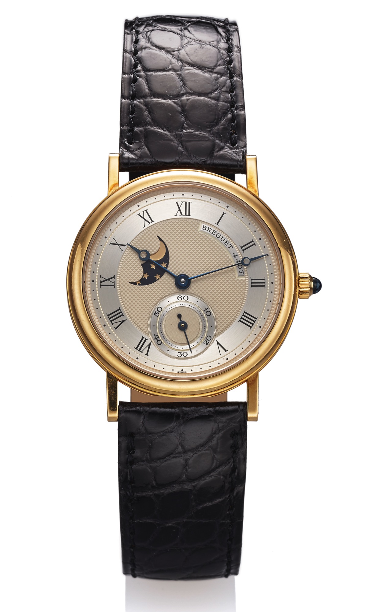BREGUET REF. 3300 YELLOW GOLD 
Breguet, No. 4407, Ref. 3300. Made in the 1990s. 
Fine, astronomic, 18K yellow gold wristwatch with moon 
phases and an 18K yellow gold Breguet buckle. Accompanied 
by the certificate of origin and guarantee.