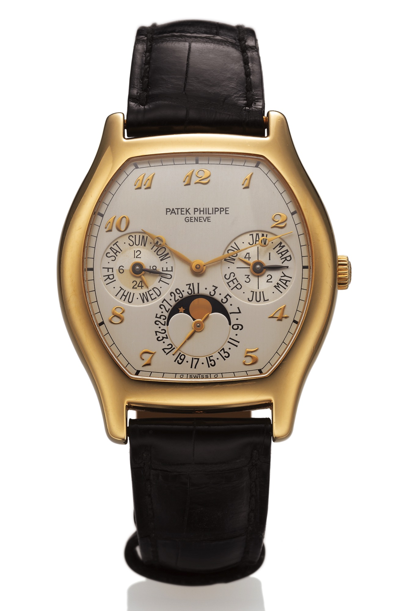 PATEK PHILIPPE REF 5040 YELLOW GOLD 
Patek Philippe, Genève, movement No. 776581, 
Ref. 5040J. Made circa 1994. 
Very fine and rare, tonneau-shaped, self-winding, 
18K yellow gold wristwatch with perpetual calendar, 
moon phases, 24-hour indication and 18K 
yellow gold Patek Philippe deployant clasp.