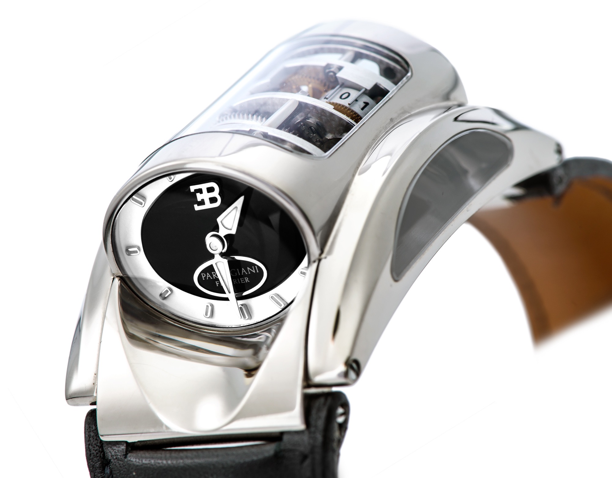 PARMIGIANI FLEURIER BUGATTI WHITE GOLD LIMITED EDITION
Parmigiani Fleurier, Bugatti, case No.11837. Made in a limited edition of 50 pieces circa 2005. 
Extremely fine, rare and unusual, rectangular curved, movement constructed in the shape of an automotive engine encased in an oval-shaped 
cylinder, 18K white gold driver's wristwatch with 10-day autonomy (displayed on a graduated drum) and an 18K white gold Parmigiani double 
deployant clasp. Accompanied by key.