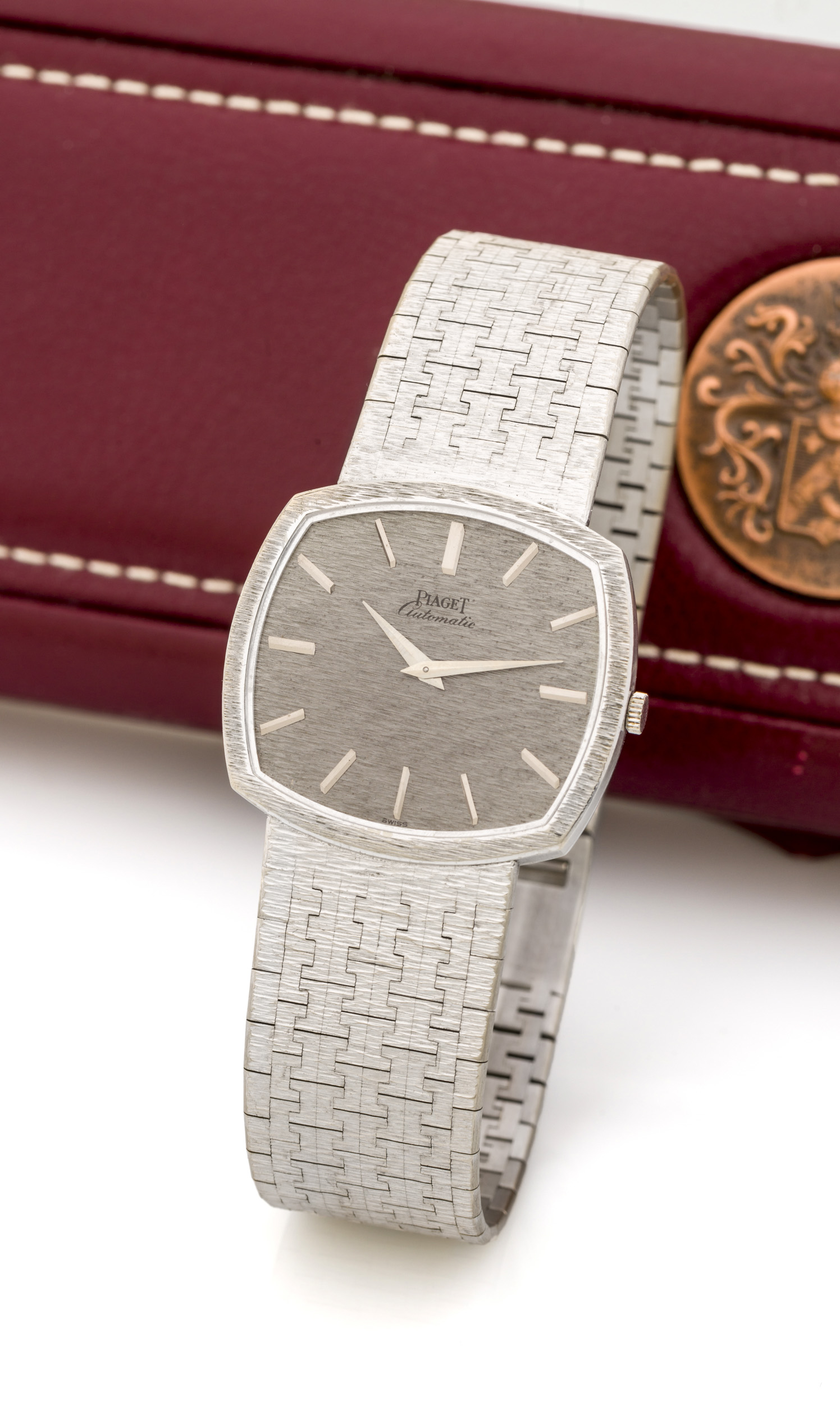 PIAGET, REF. 12401, WHITE GOLD A fine, self-winding 18k white gold wristwatch with integrated bracelet.