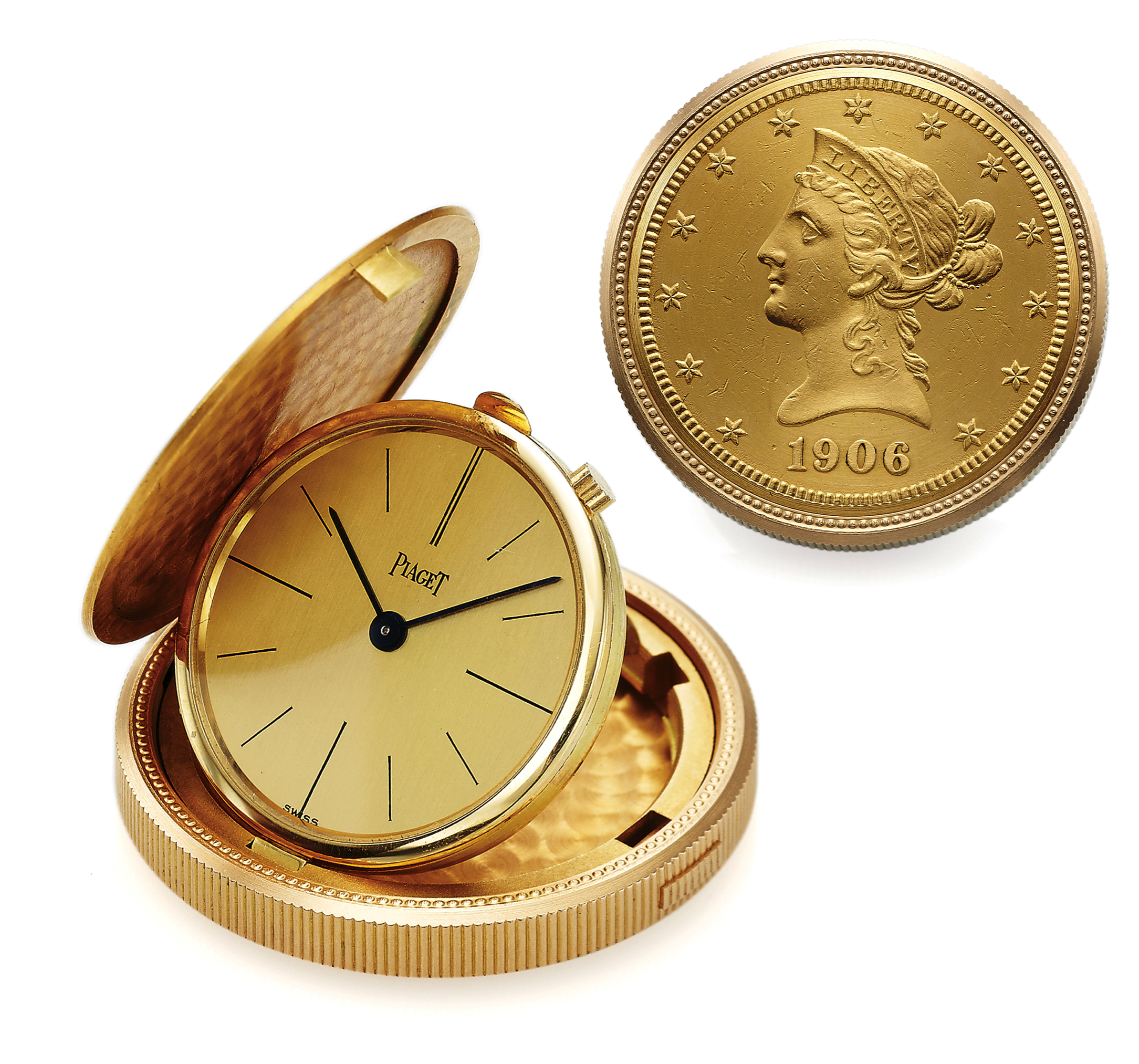 PIAGET TEN DOLLAR GOLD COIN 
DRESS WATCH YELLOW GOLD 
Piaget, 'Ten Dollars 1906,' case No. 950. Made in the 1980s. 
Very fine, 18K yellow gold $10 U.S. coin dated 1906 with 
concealed watch. Accompanied by the original fitted box.