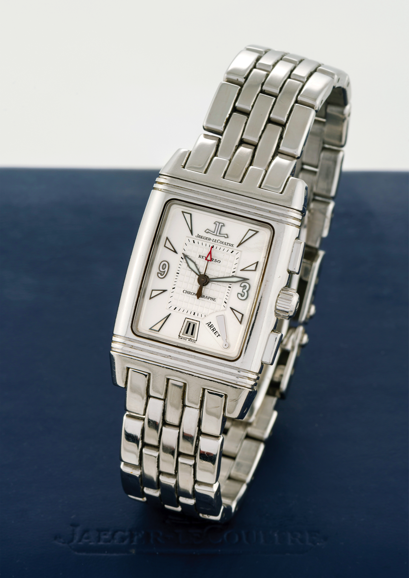 JAEGER-LECOULTRE REF. 295.8.59 STEEL CHRONO REVERSO - DUOFACE 
Jaeger-LeCoultre, "Reverso - Gran' Sport - Chronograph Retrograde," case No. 1970627, Ref. 295.8.59. 
Made circa 2005. 
Fine, rectangular and reversible, double-dial, water-resistant, stainless steel wristwatch with square button 
chronograph, retrograde 30-minute register, date, chronograph start/stop indication and a stainless 
steel Jaeger-LeCoultre bracelet with double deployant clasp. Accompanied by a Jaeger-LeCoultre box, 