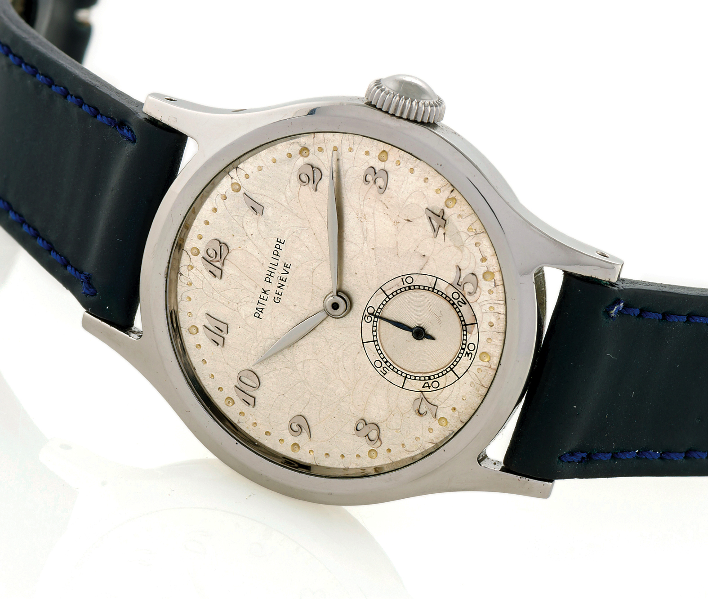 PATEK PHILIPPE REF. 565 BREGUET NUMERALS STEEL 
Patek Philippe & Co, Genève, Calatrava, No. 963854, case No. 648615, Ref. 565. 
Made in 1949, sold on August 24th, 1949. 
Very fine and rare, water-resistant, stainless steel wristwatch with a stainless steel 
Patek Philippe buckle. Accompanied by the extract from the archives.