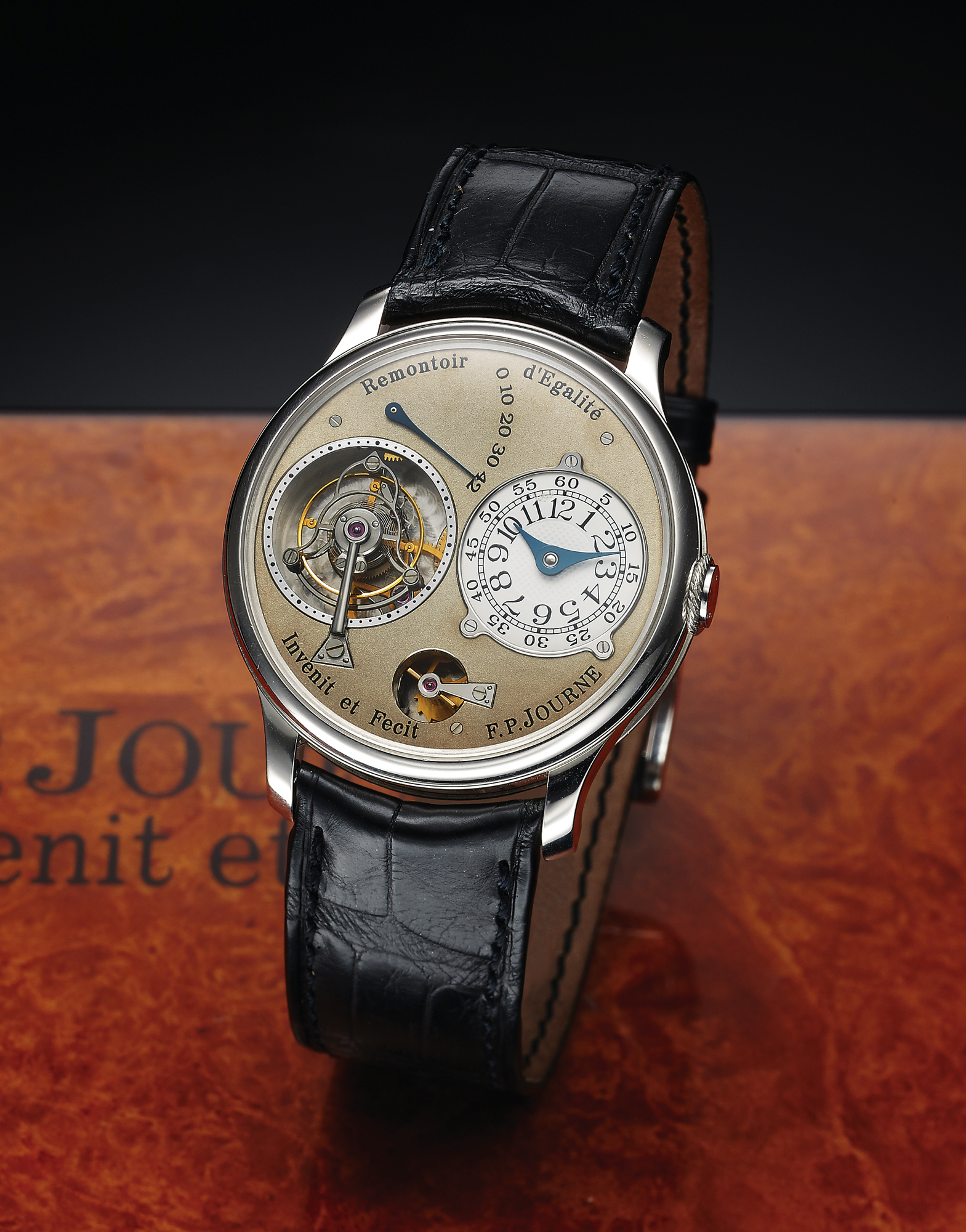 F.P. JOURNE TOURBILLON SOUVERAIN, PLATINUM 
F.P. Journe, "Invenit et Fecit," Remontoir d'Egalité - Tourbillon 
Souverain, No. 212-03T. Made in the 2000s. 
Very fine and rare, platinum Chronometer wristwatch with 
visible one-minute tourbillon regulator and constant force 
remontoir, 42-hour power reserve indication and a platinum 
F.P. Journe buckle. Accompanied by the original fitted box 
and booklet.