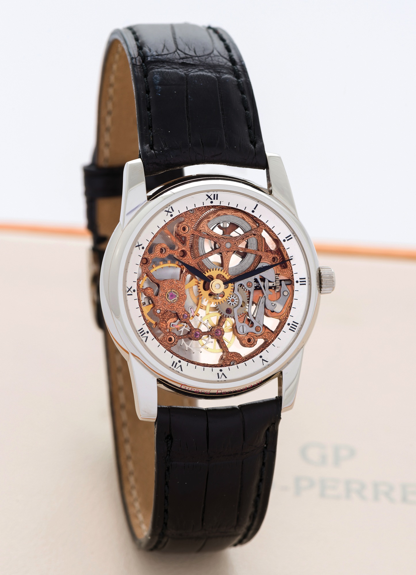 GIRARD-PERREGAUX, REF. 9030 - PLATINUM SKELETONIZED
Girard-Perregaux, Swiss, "Squelette", No. PT-16, Ref. 9030. Made circa 2000.
Very fine, mid-size, platinum wristwatch with skeletonized movement and 
an 18K white gold GP buckle. Accompanied by a Girard-Perregaux fitted 
box, hang-tag and booklets.