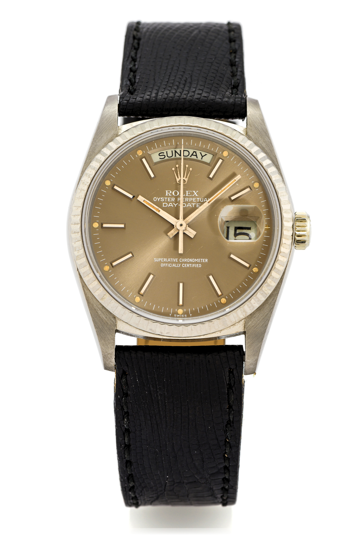 ROLEX REF. 18039/18038 DAY DATE WHITE GOLD 
Rolex, Oyster Perpetual, Day Date, Superlative Chronometer Officially 
Certified, case No. 6739240, Ref. 18039/18038. Made in 1981. 
Very fine, tonneau-shaped, center seconds, self-winding, 18K white gold 
wristwatch with day & date and a stainless steel Rolex buckle.