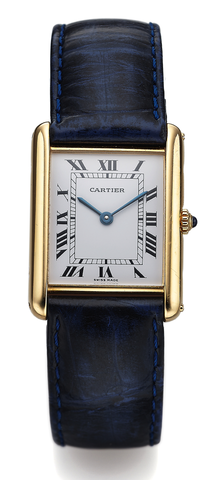 CARTIER TANK YELLOW GOLD QUARTZ 
Cartier, Paris, "Tank," case No. 8810527144. Made in the 1980s. 
Fine and elegant, rectangular, thin, 18K yellow gold quartz wristwatch with a gold-plated Cartier buckle. Accompanied by a Cartier service 
guarantee dated March 13, 2006.