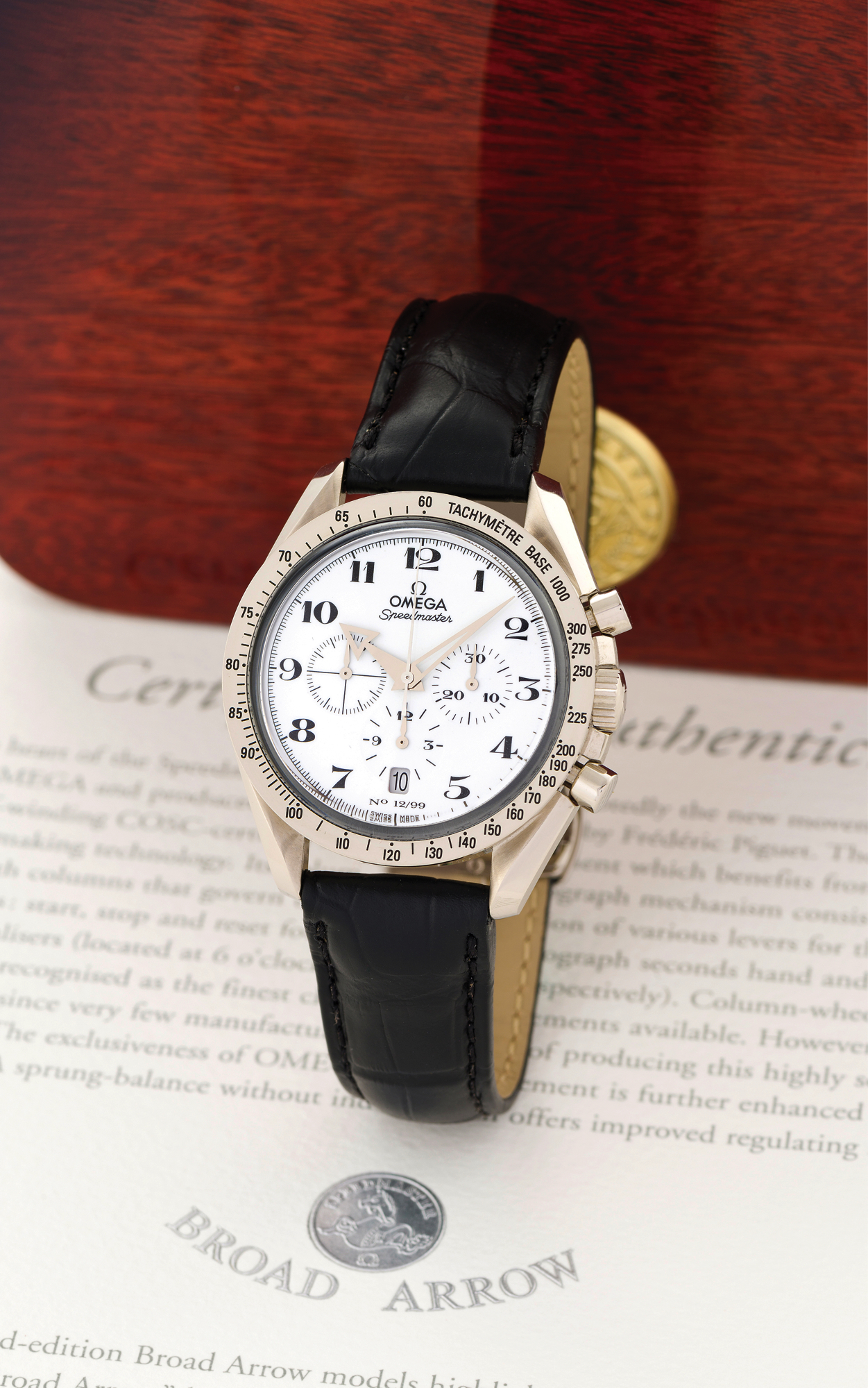 OMEGA SPEEDMASTER WHITE GOLD, 
ENAMEL DIAL, NO. 12/99
Omega, "Speedmaster", No. 12/99, movement and case No. 
78020338, Ref. 36572031. Made in a limited edition of 99 pieces, in 
2001. 
Fine and rare, water-resistant, self-winding, 18K white gold 
Chronometer wristwatch with round button chronograph, registers, 
tachometer, date and an 18K white gold Omega deployant clasp. 
Accompanied by fitted box, warranty, Chronometer certificate and 
booklets.