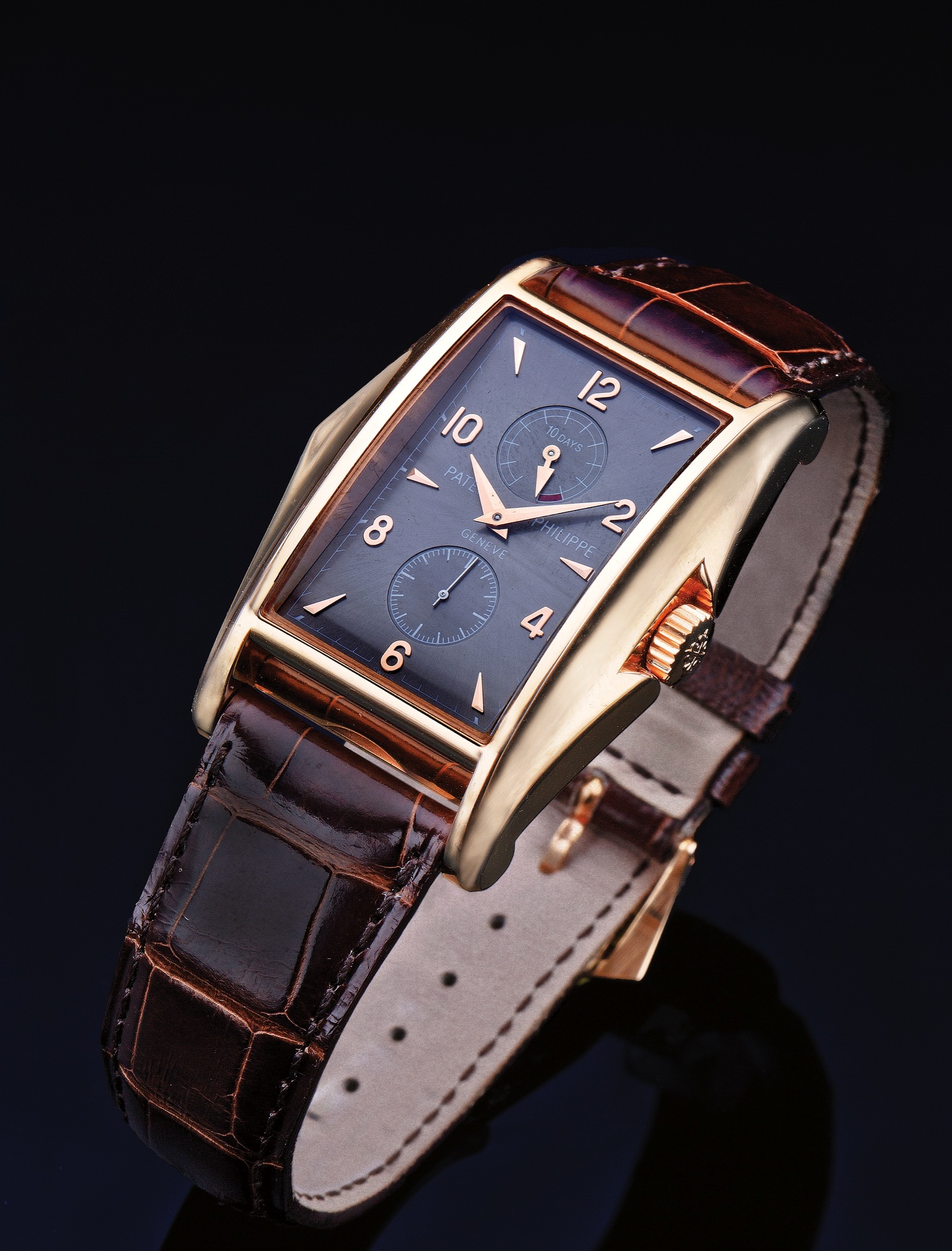 PATEK PHILIPPE REF. 5100 '10 DAYS' PINK GOLD 
Patek Philippe, Genève, "10 Days" movement No. 3203509, case 
No. 4102739, Ref. 5100R. Made in a limited edition of 750 pieces 
to celebrate the new millennium, sold May 1, 2001. 
Very fine, rectangular lozenge-shaped, water-resistant, 18K 
pink gold Chronometer wristwatch with 10-day power reserve 
and an 18K pink gold Patek Philippe buckle. Accompanied by 
the a fitted Patek Philippe box, Certificate of Origin, C.O.S.C. 
certificate, Attest