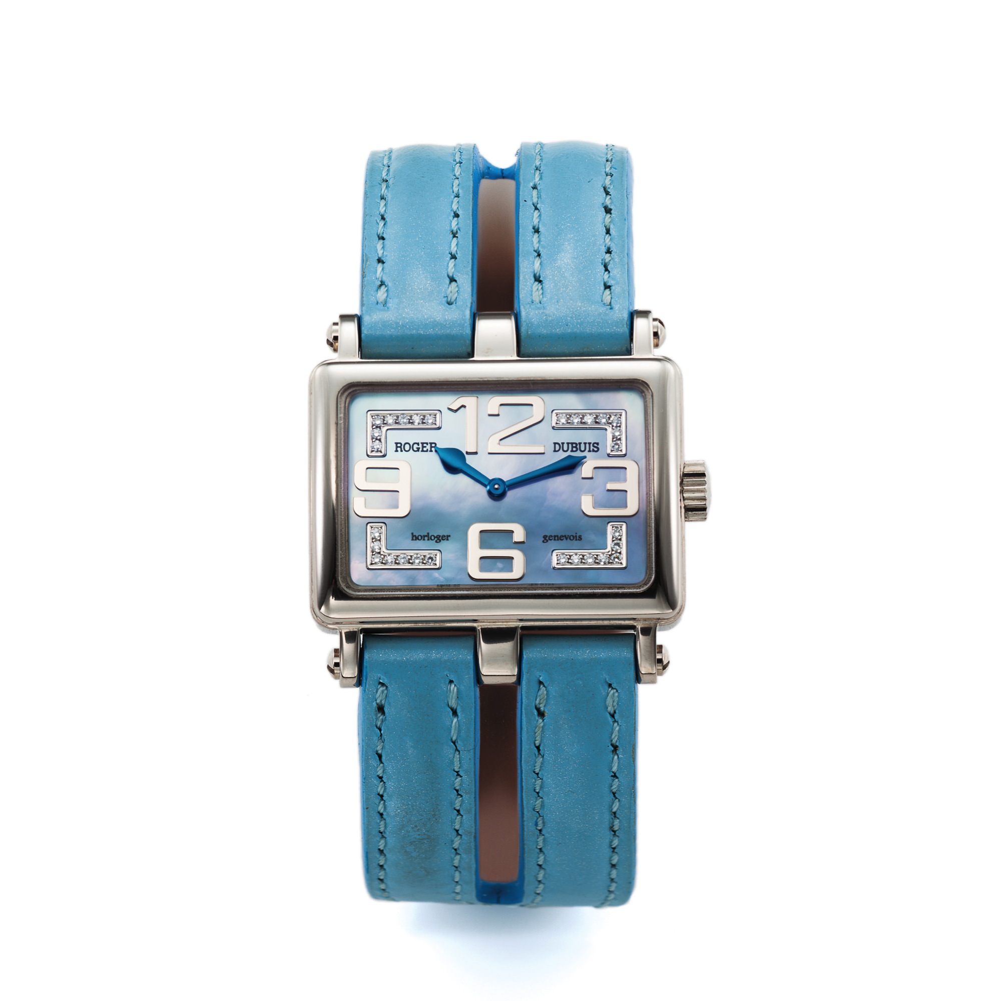 ROGER DUBUIS TOO MUCH
DIAMOND AND WHITE GOLD
Roger Dubuis, Horloger Genevois, "TooMuch," No. 04/28. Made in a 
limited edition of 28 pieces circa 2006. 
Fine and rare, horizontal rectangular and curved, water-resistant, 
18K white gold and diamond lady's wristwatch with a diamond set blue mother-of-pearl dial and an 18K white gold and diamond Roger Dubuis buckle.