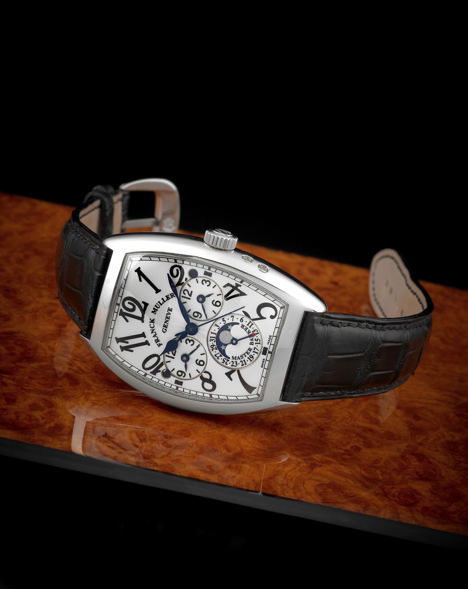 FRANCK MULLER REF. 7880 MB L DT THREE TIME
ZONE DATE AND MOON PHASE STEEL
Franck Muller, Genève, Cintrée Curvex Master Banker Lunar
Date, No. 326, Ref. 7880 MB L DT. Made circa 2006.
Fine, three time zone, curved tonneau-shaped, self-winding,
water-resistant, center-seconds, stainless steel wristwatch
with one crown for adjusting all three dials, two day and night
indicators, date, moon phase and a stainless steel Franck
Muller buckle. Accompanied by the original fitted wooden
box and i