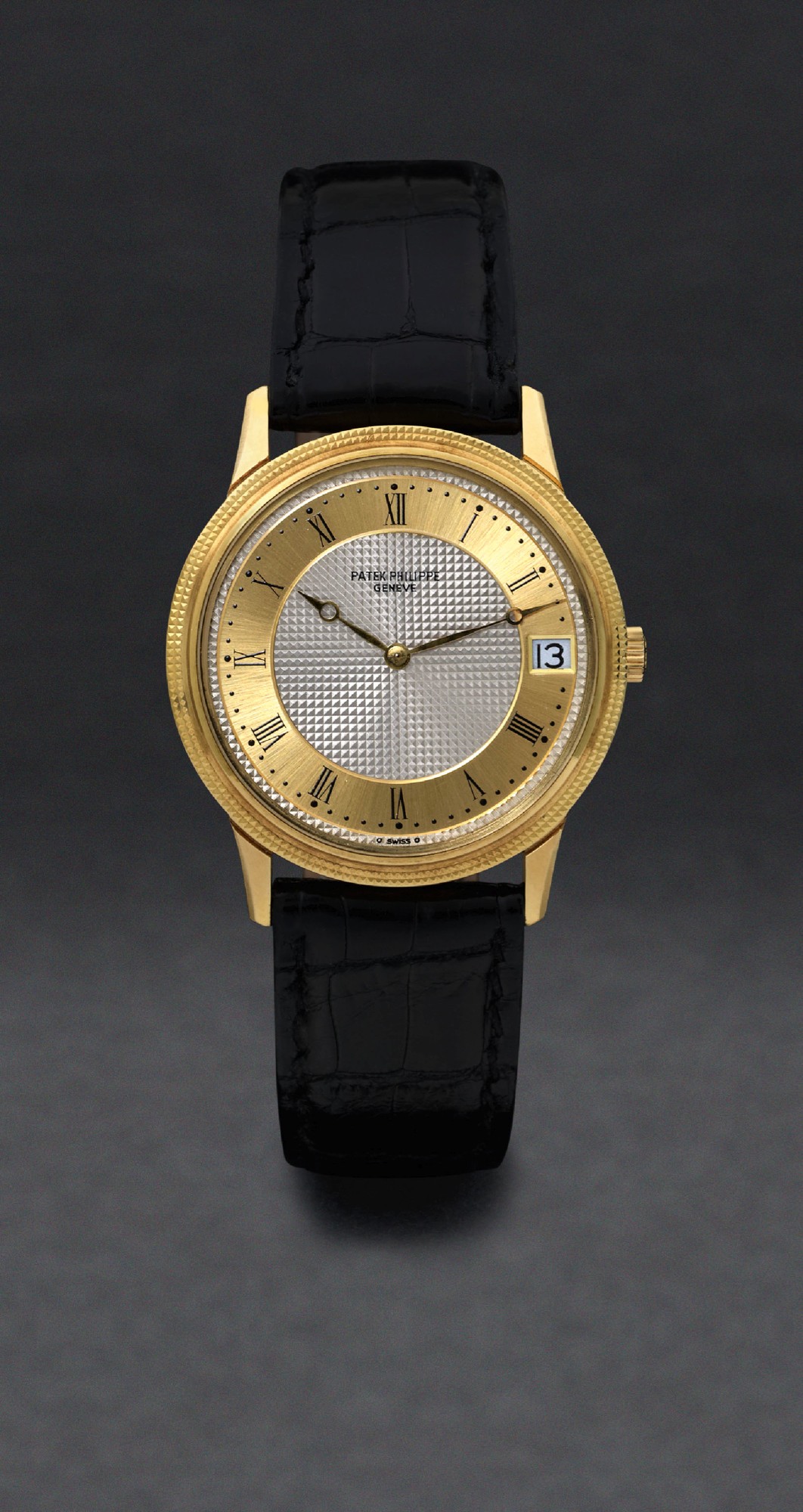 PATEK PHILIPPE REF. 3602 TWO TONE DIAL
Patek Philippe, Genève, No. 1306031, case No. 539833,
Ref. 3602. Made in 1978, sold on March 20th, 1980.
Very fine, self-winding, 18K yellow gold wristwatch with date,
two-tone dial and an 18K yellow gold Patek Philippe buckle.
Accompanied by the Extract from the Archives.