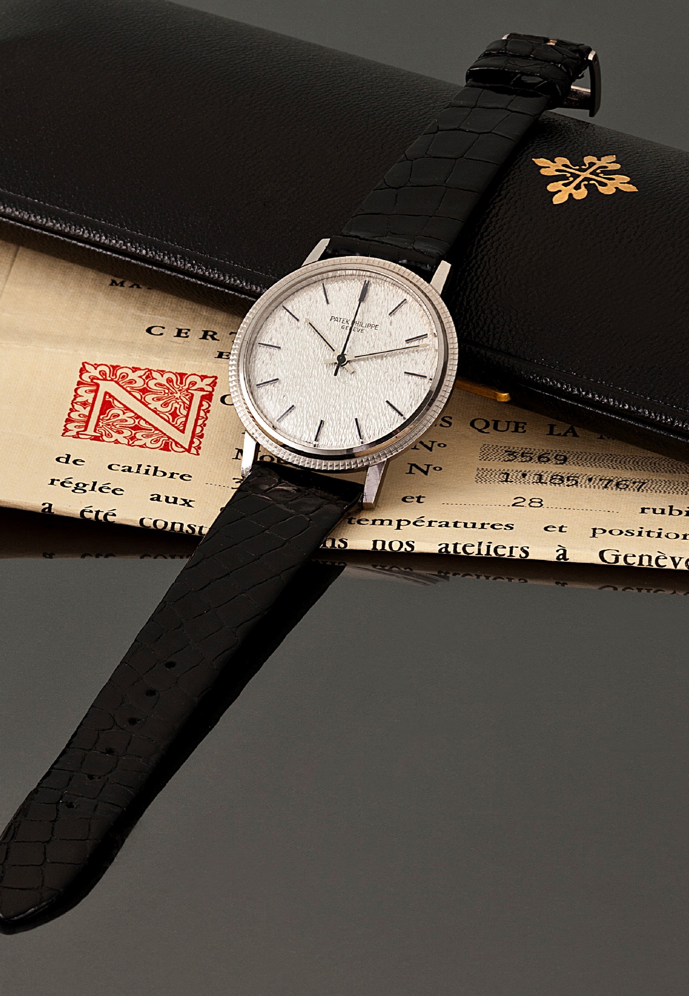 PATEK PHILIPPE REF. 3569 AUTOMATIC WHITE GOLD
Patek Philippe, Genève, No. 1185767, case No. 2727711, Ref. 3569. Made in the 1970s.
Fine, center seconds, self-winding, water-resistant, 18K white gold wristwatch with an 18K white gold Patek Philippe buckle.
Accompanied by a Patek Philippe box and Certificate of Origin.