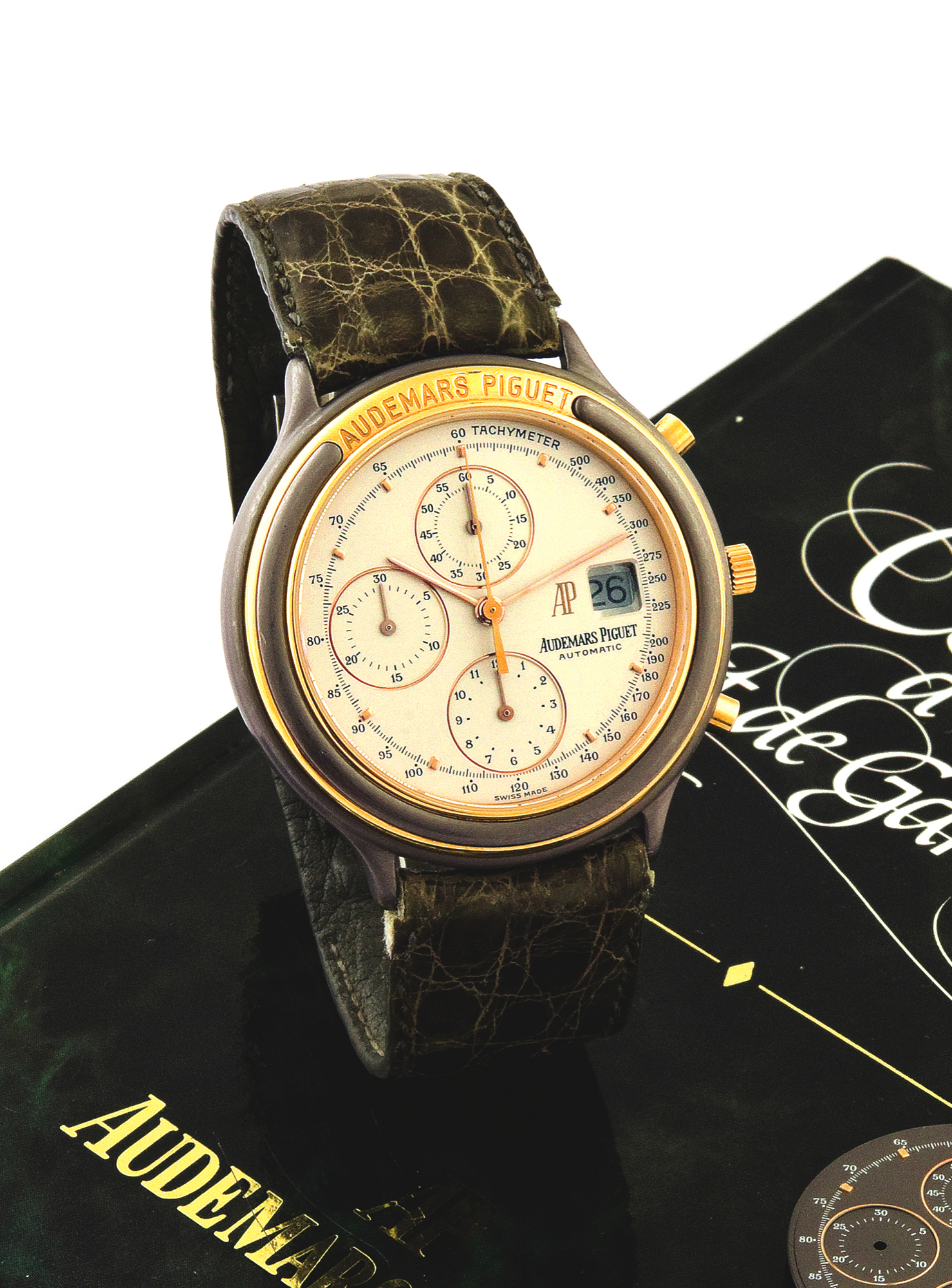 Audemars Piguet Chrono Tantale
Audemars Piguet, ?Automatic?, movement No.
347905, case No. C62593, Ref. TR 25644. Made in
the 1990?s.
Fine and unusual, self-winding, ?tantale? and
18K yellow gold wristwatch with round button
chronograph, registers, tachometer and date
with a stainless steel and yellow gold Audemars
Piguet deployant. Accompanied by Certificate and
additional dial.