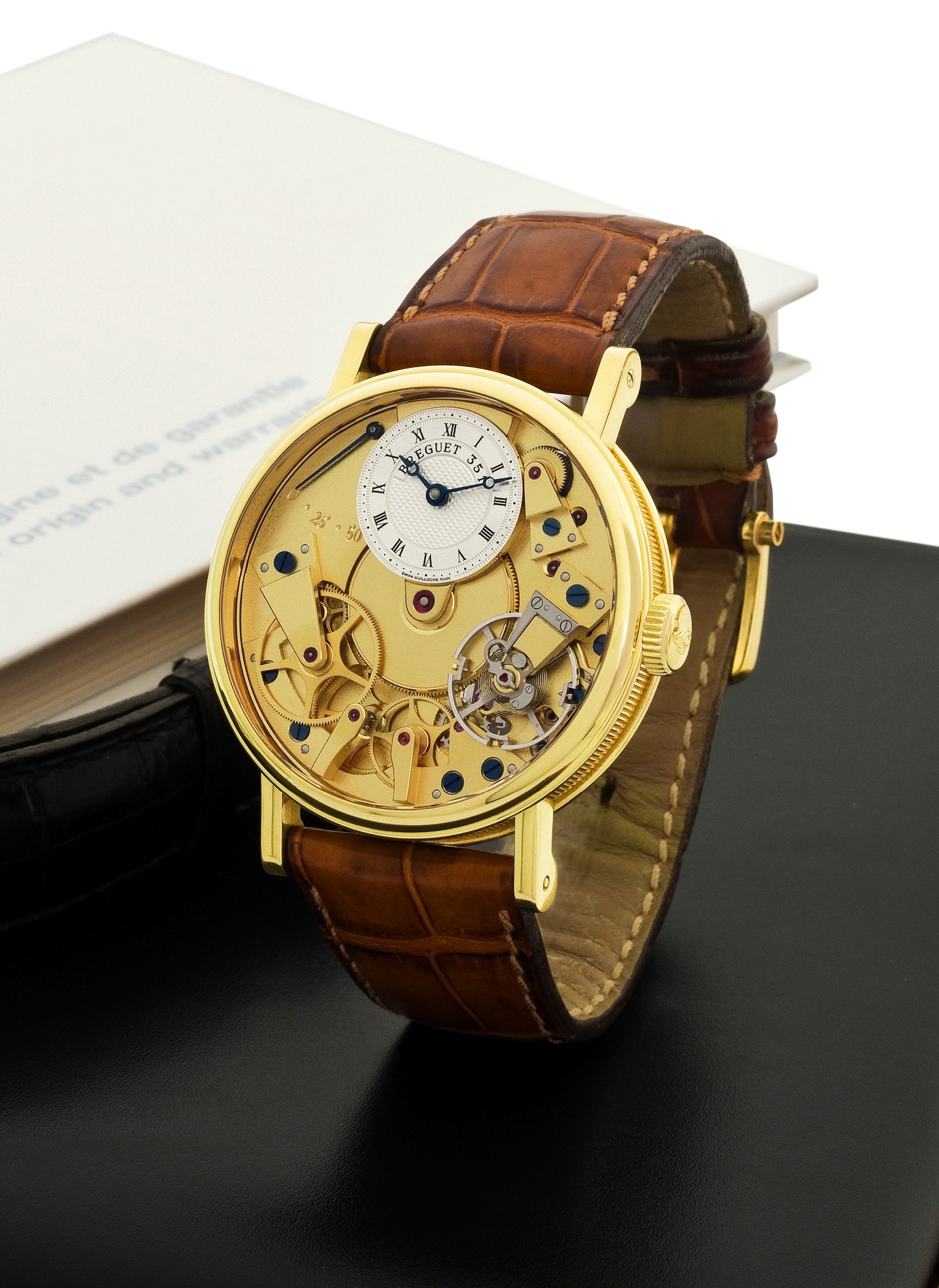 BREGUET REF.7027, CLASSIQUE "LA TRADITION BREGUET"
Breguet, ?La Tradition?, No. 351, Ref. 7027. Sold on February 18th, 2006.
Very fine, water-resistant, 18K yellow gold wristwatch with visible ?Souscription? style caliber, double power reserve indication and
an 18K yellow gold Breguet buckle. Accompanied by a Breguet fitted box, user's manual and Certificate of Origin.