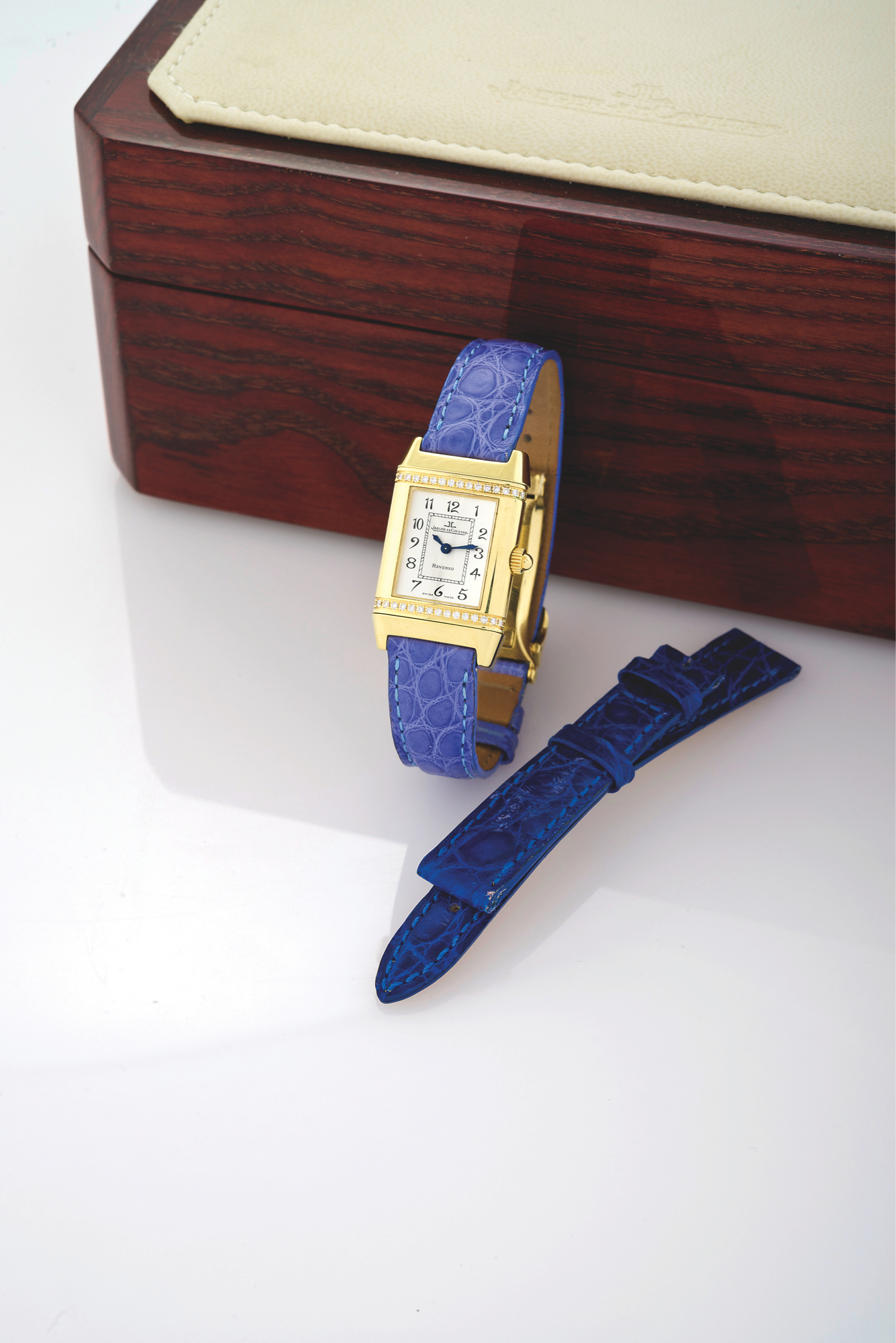 REVERSO JOAILLERIE
Jaeger-LeCoultre, ?Reverso Joaillerie,? No. 2082758, Ref. 265.1.08. Made in the 2000s.
Fine and elegant, rectangular, 18K yellow gold and diamond lady?s reversible quartz wristwatch with an 18K yellow gold Jaeger-LeCoultre deployant clasp. Accompanied by the original fitted box, spare strap and booklet