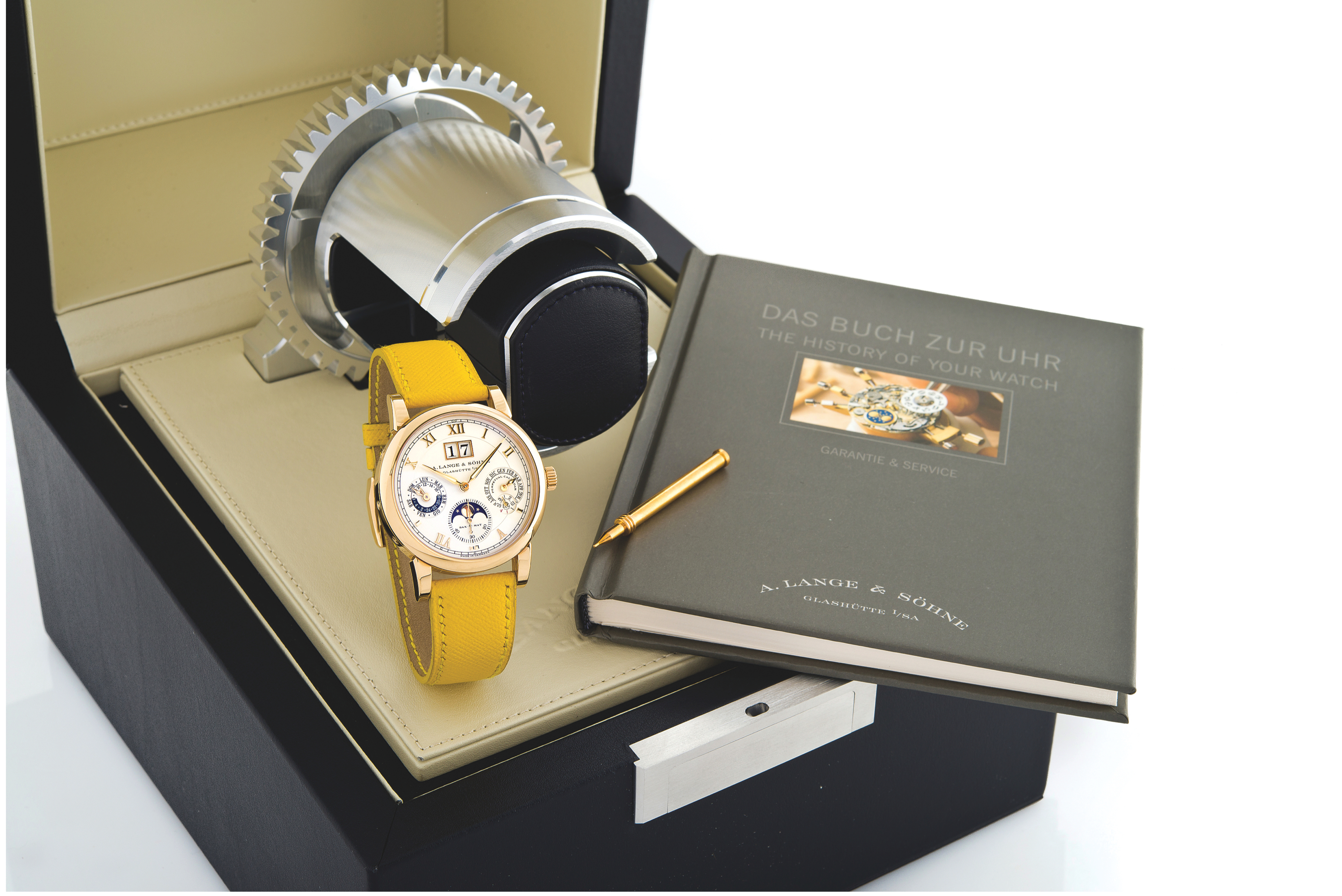 LANGE & SÖHNE REF. 310.032 SAX-O-MAT PERPETUAL
CALENDAR, PINK GOLD
A.Lange & Söhne, Glashütte i./Sa., Langematik Perpetual, movement
No. 64109, case No. 176844, Ref. 310.032. Sold in December 2009.
Production of this reference started in 2001.
Very fine and rare, self-winding, water-resistant, 18K pink gold
wristwatch with perpetual calendar, leap year indication, oversized
date, 24-hour indication, moon phases and an 18K pink gold Lange
buckle. Accompanied by the original fitted winding