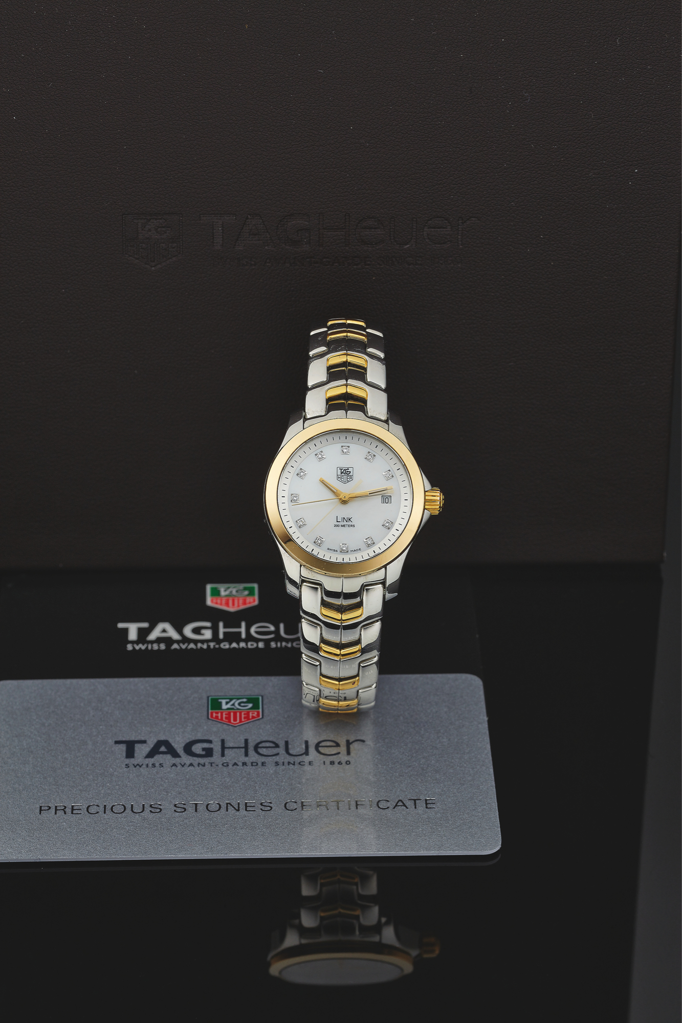 TAG HEUER REF. WV1411
LINK QUARTZ STEEL GOLD & DIAMOND
Tag Heuer, Swiss, Link, No. RBQ0807, Ref. WJF1353. Made
circa 20010, sold March 12th, 2012.
Fine, center seconds, water resistant to 200 m, stainless
steel, 18K yellow gold and diamonds quartz wristwatch
with date and a Tag Heuer stainless steel and 18K yellow
gold link bracelet with deployant clasp. Accompanied by
the original fitted box and guarantee.
