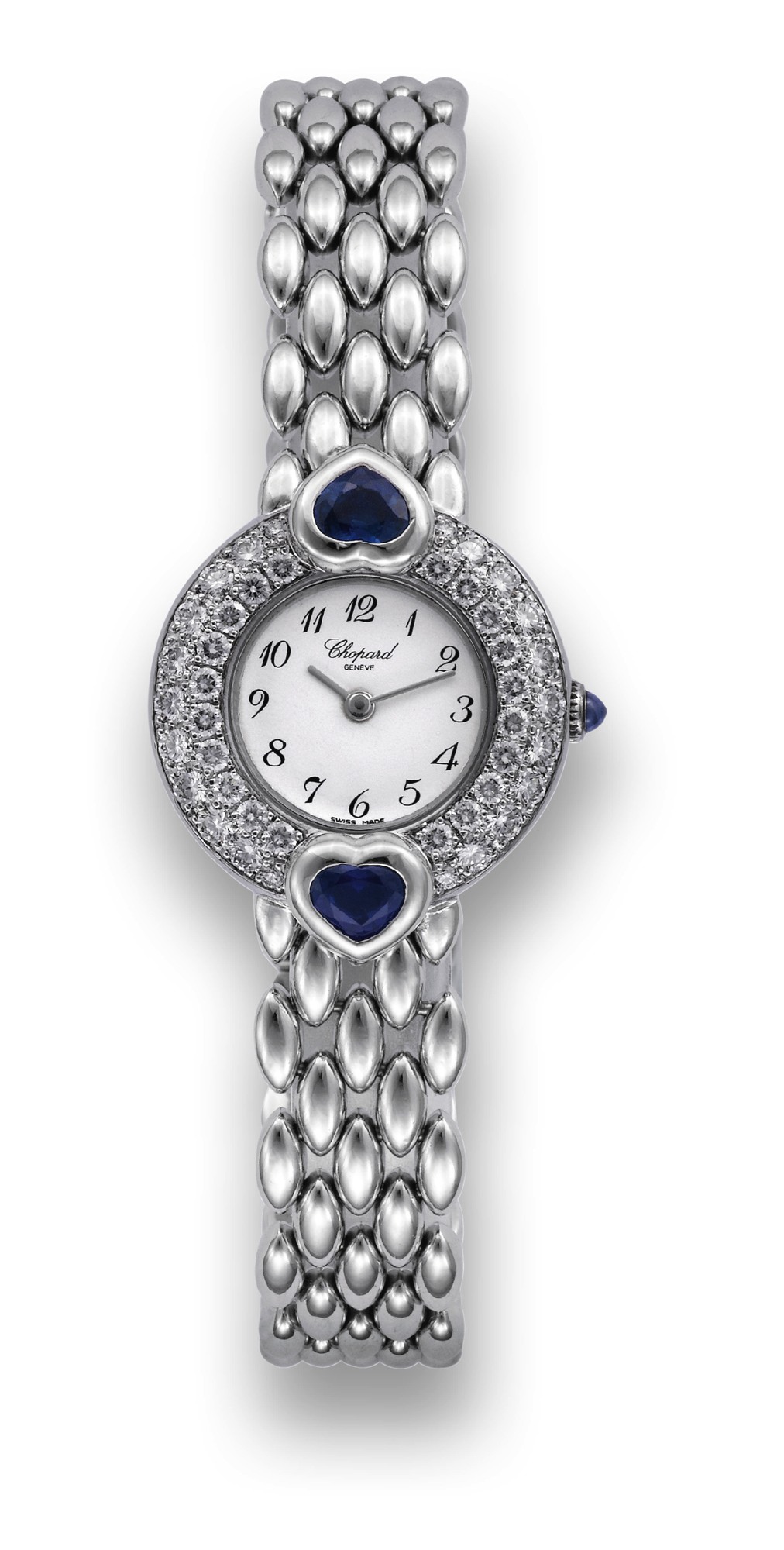 CHOPARD REF. 915 1 CASMIR WHITE GOLD
DIAMOND AND SAPPHIRE
Chopard, Genève, Casmir, Ref. 915 1. Produced in the 1990's.
Very fine, water-resistant, 18K white gold, diamond and
sapphire-set lady's quartz wristwatch with an integrated 18K
white gold oval-sculpted bracelet.
