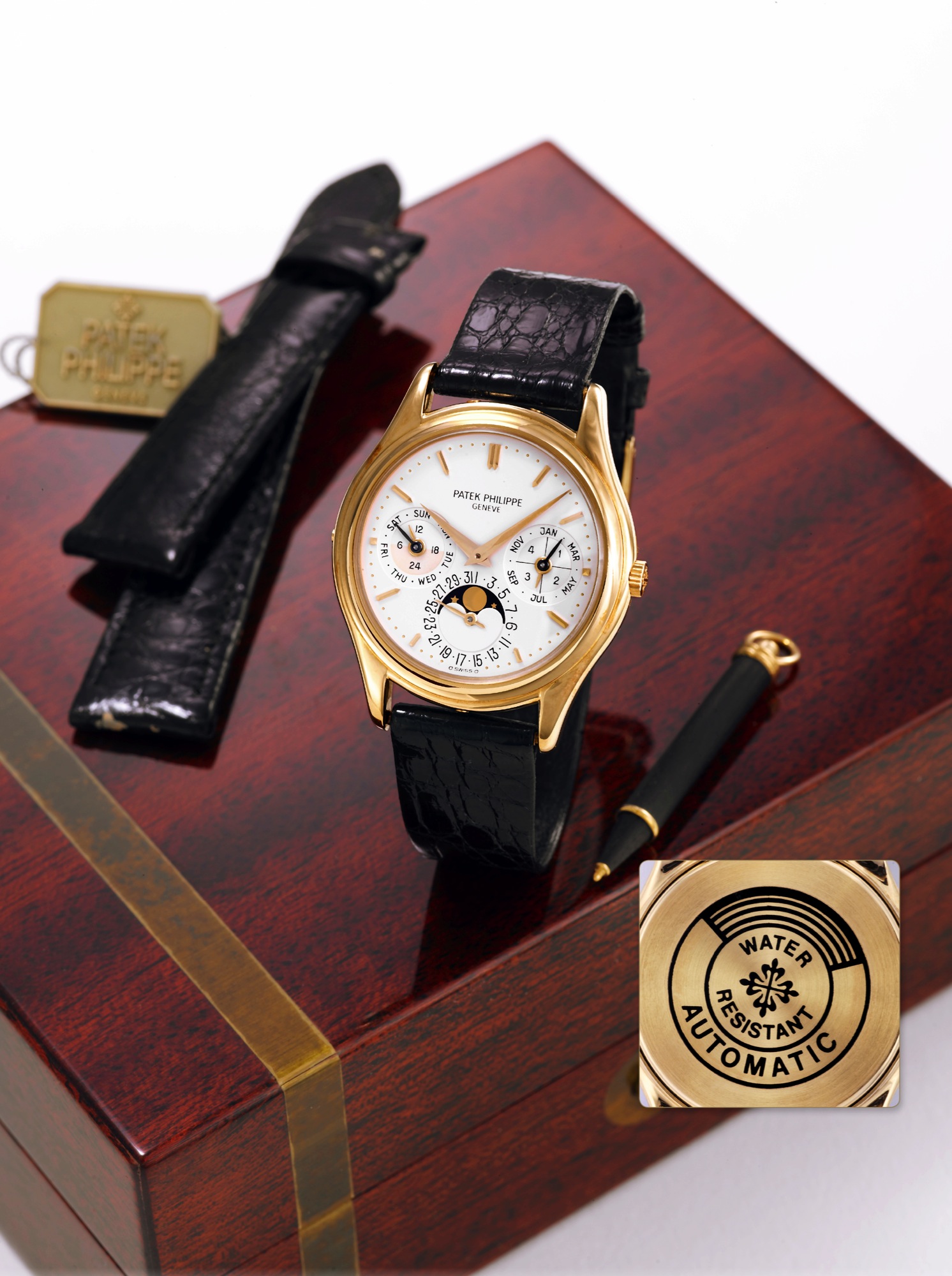 Patek Philippe Ref. 3940
Patek Philippe, Genève, Ref. 3940, ?Third Generation?, movement No. 771842,
case No. 2866831. Made in the 1990s.
Very fine and rare, self-winding, 18K yellow gold wristwatch with perpetual calendar,
24 hour and leap year indication, moon phases and a 18K yellow gold Patek Philippe
buckle. Accompanied by a fitted box, setting pin, tag and extra strap.