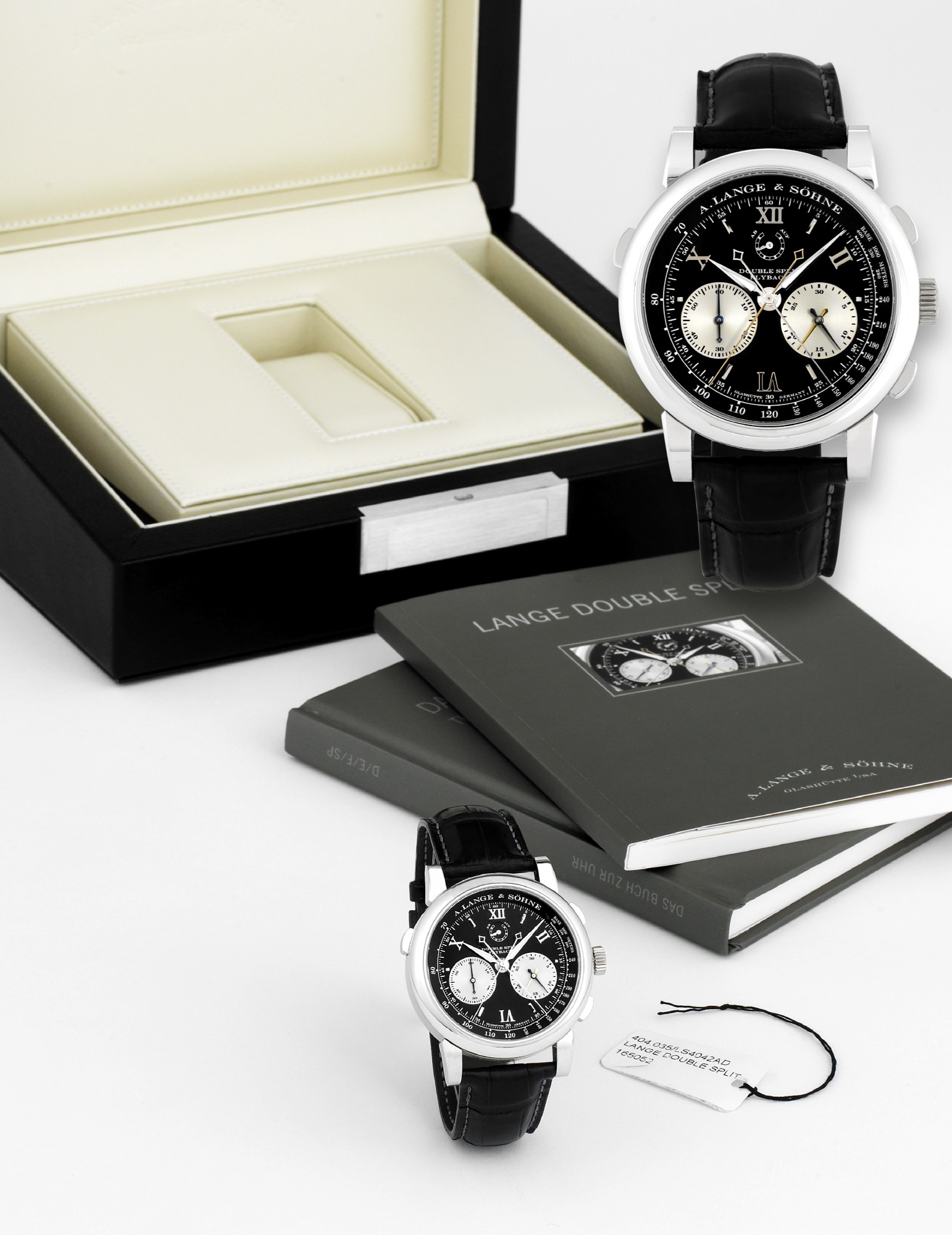 A. LANGE & SOHNE PLATINUM DOUBLE SPLIT FLY BACK
A. Lange & Söhne, Glashütte i. SA., "Double Split Flyback," No. 55071, case No. 165052, Ref. 404.035.
Made in 2007. Production of this reference started in 2005.
Very fine, rare and important, platinum wristwatch with square button split-seconds and split-minutes
fly-back chronograph, register, tachometer, power-reserve indication and an A. Lange & Söhne platinum
buckle. Accompanied by the original fitted box, certificate and manual.