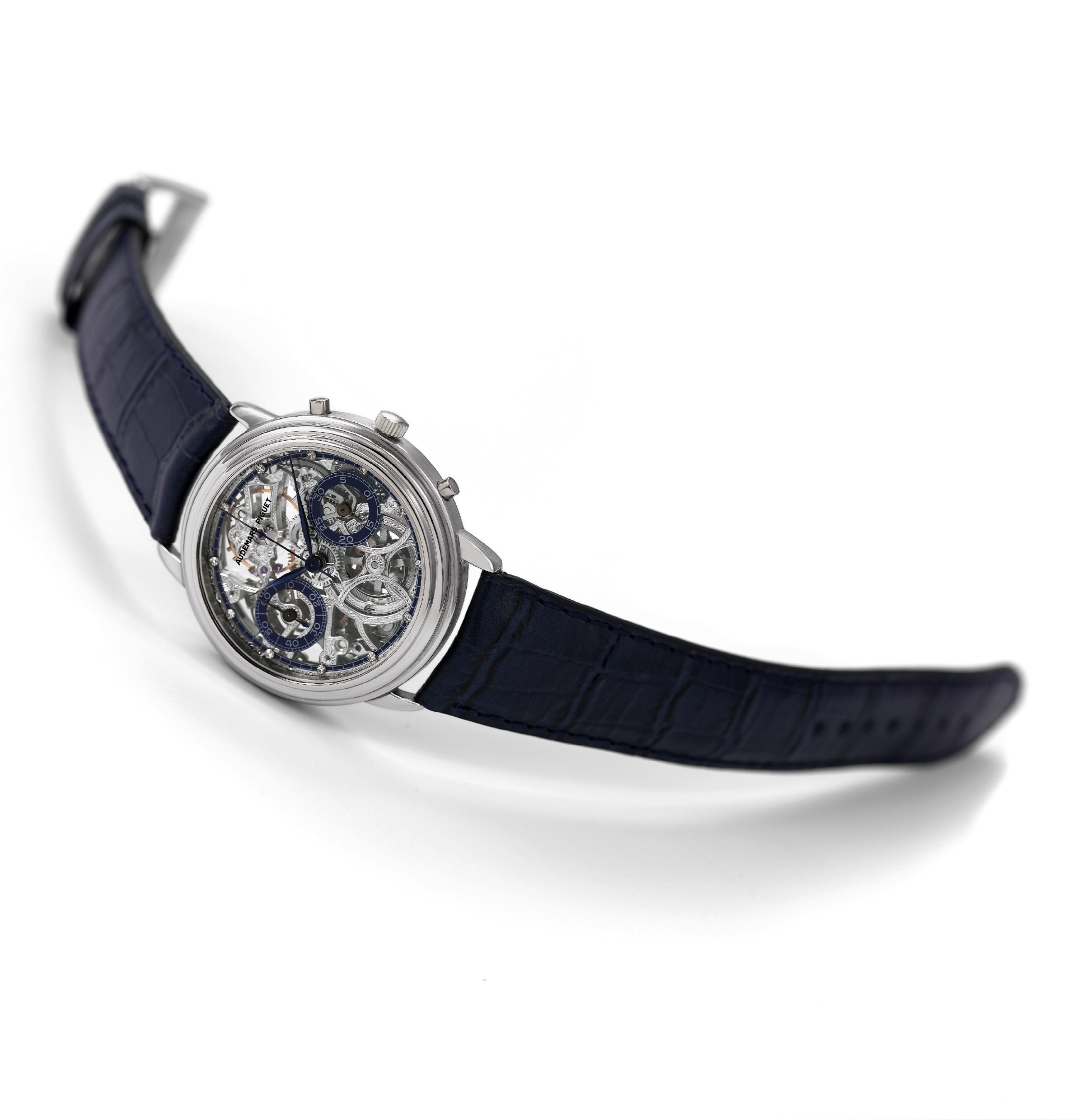 Audemars Piguet, Platinum Skeletonized Chronograph
Audemars Piguet, Genève, movement No. 398851, case No. D 29666. Made circa 1985.
Very fine, skeletonized, 18K platinum wristwatch with round button chronograph, register and a platinum Audemars Piguet buckle.