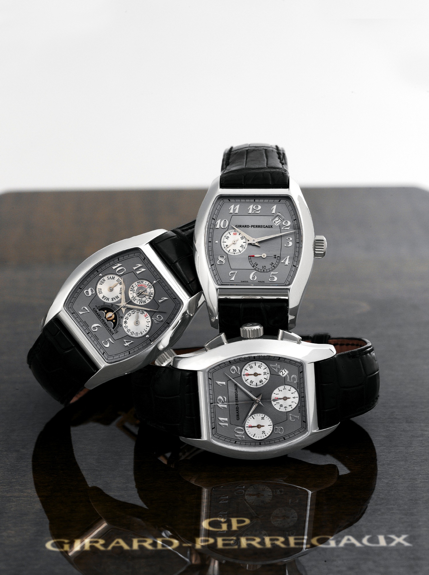 Girard-Perregaux, "Richeville Collection Complication Set", Made
circa 2000.
Extremely fine set of three, large, rectangular curved, selfwinding,
water-resistant, platinum wristwatches. Accompanied by
the special Girard-Perregaux fitted box for the three watches with
winding carrousel and setting pin.
A) GIRARD PERREGAUX PLATINUM PERPETUAL CALENDAR
Girard-Perregaux, La Chaux-de-Fonds, Richeville Collection
"Quantième Perpetuel", Ref. 2722.
Fine and rare, tonneau-shaped, self-winding, pl