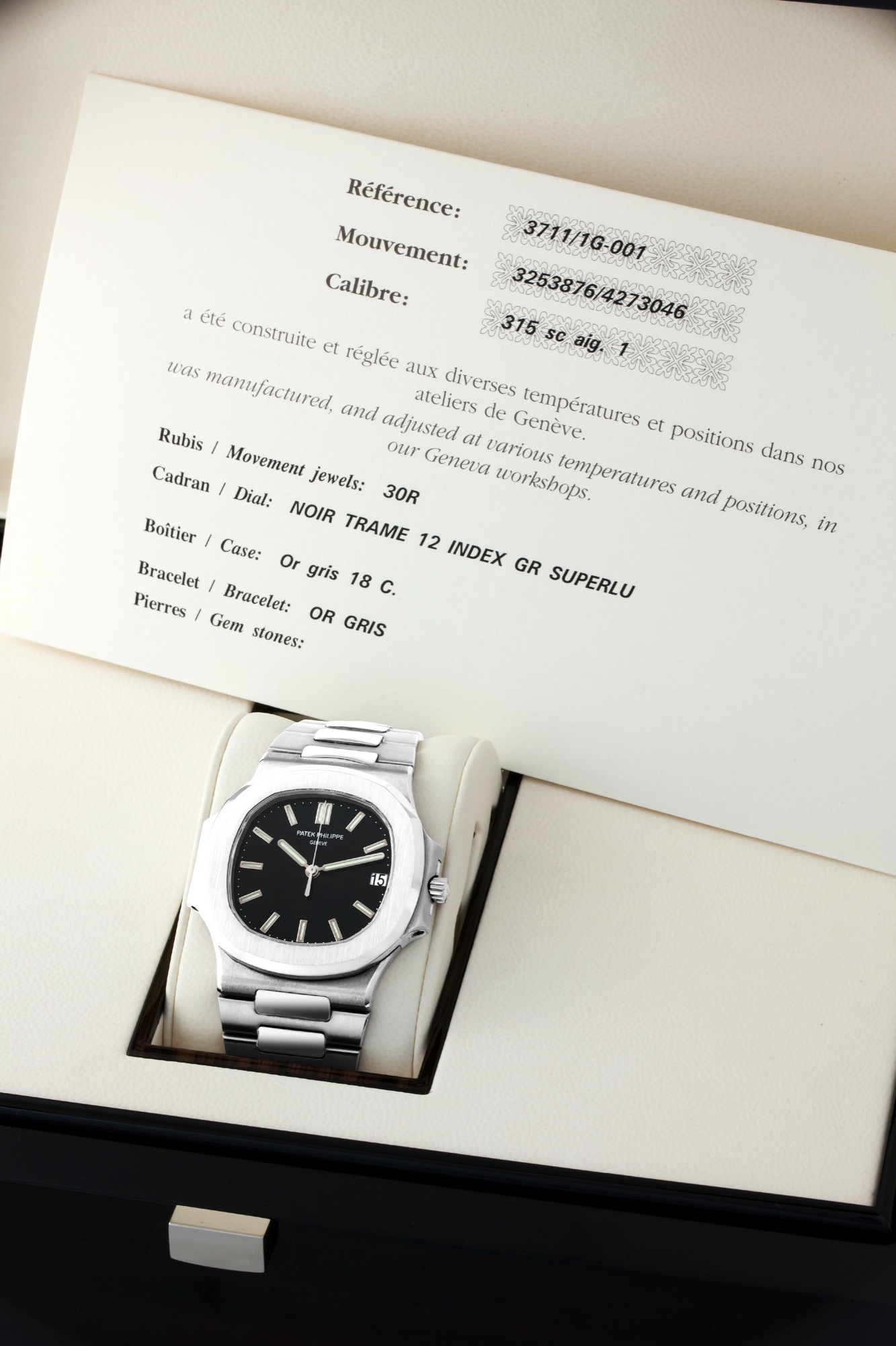 Patek Philippe White Gold, Ref. 3711/1G Nautilus
Patek Philippe, Genève, ?Nautilus?, movement No. 3253876, case No. 4273046, Ref. 3711/1G. Made in 2005, sold on
October 1st, 2005.
Very fine, water-resistant, self-winding, center seconds, 18K white gold wristwatch with date and an 18K white gold Patek Philippe
bracelet with double deployant clasp. Accompanied by the original Patek Philippe fitted box, extra bracelet link, Certificate of
Origin and booklets.