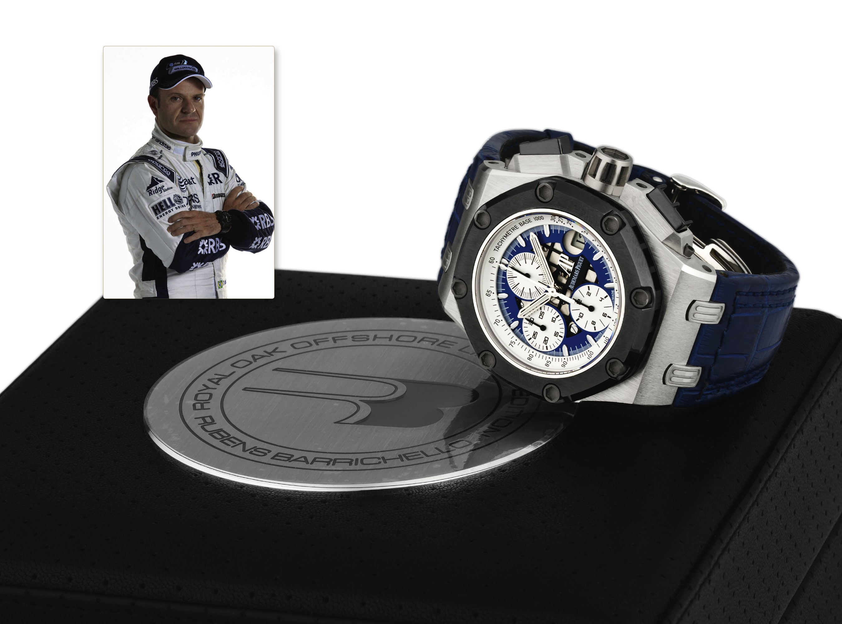 ROYAL OAK OFFSHORE, RUBENS BARRICHELLO II
PLATINUM, NO. 002
Audemars Piguet, ?Royal Oak Offshore, Limited Edition,
Rubens Barrichello II?, No. 002/150, Made in a limited edition
of 150 pieces in platinum in 2006.
Very fine and very rare, oversized, octagonal, self-winding,
water-resistant, platinum and ceramic wristwatch with date,
square button chronograph, registers, tachometer and an
Audemars Piguet platinum deployant buckle. Accompanied
by the original fitted box, certificate of war
