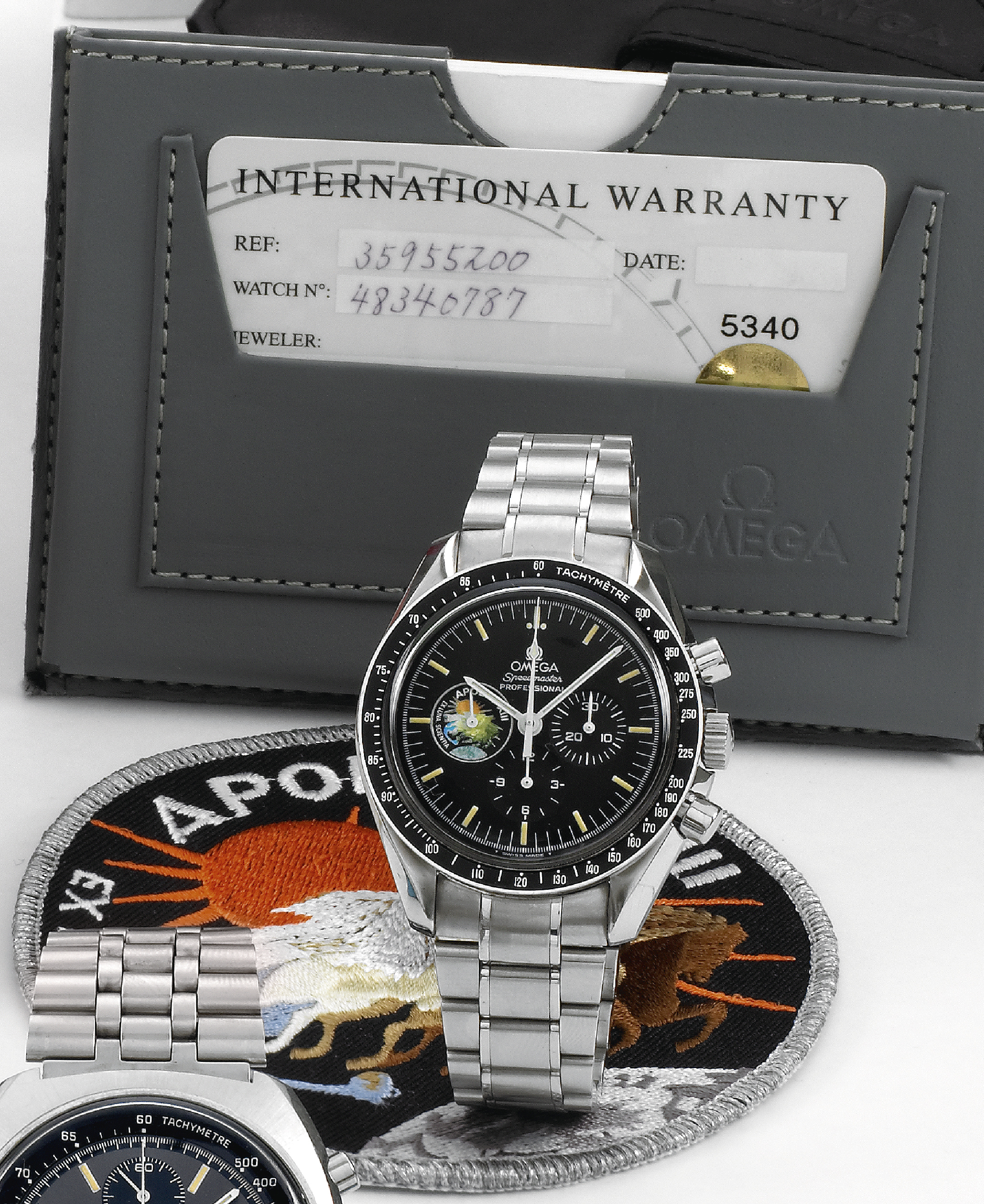Apollo XIII
Omega, ?Speedmaster Professional - Apollo XIII - Ex Luna Scientia,? No. 819/999, movement No. 48340787,
Ref. ST 345.0022. Made in a limited edition of 999 pieces circa 2000.
Fine and rare, water-resistant, stainless steel wristwatch with round button chronograph, registers, black bezel
with tachometer graduation to 500 UPH and a stainless steel Omega link bracelet. Accompanied by the original
fitted box, Warranty (now void), instruction manual and a multi color appliqué emblem (