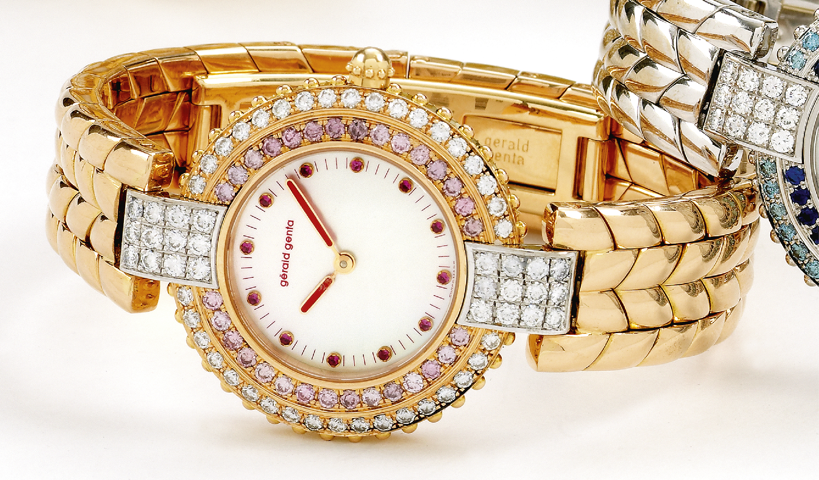 Unique Gérald Genta, No. 1/1
Gérald Genta, Genève, Ref. GGM 79, No. 1/1, made in the late 1990's.
Very fine, unique, 18K pink gold quartz wristwatch set with diamonds, pink diamonds and rubies with ruby set mother-ofpearl
dial, with an 18K pink gold Gerald Genta rope bracelet with an 18K pink gold double deployant clasp.