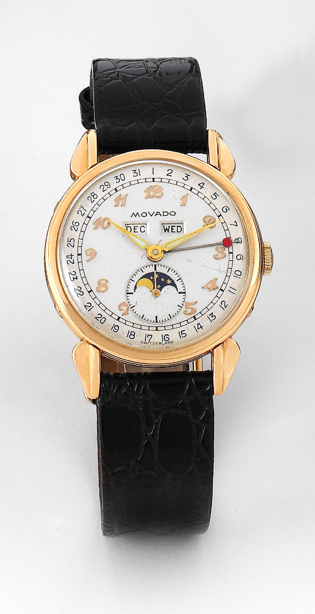 Movado Triple Calendar
Movado, Swiss, no. 492083. Ref. 14920. Made in the 1940s.
Fine, 18k pink gold triple date calendar wristwatch with moon phases.