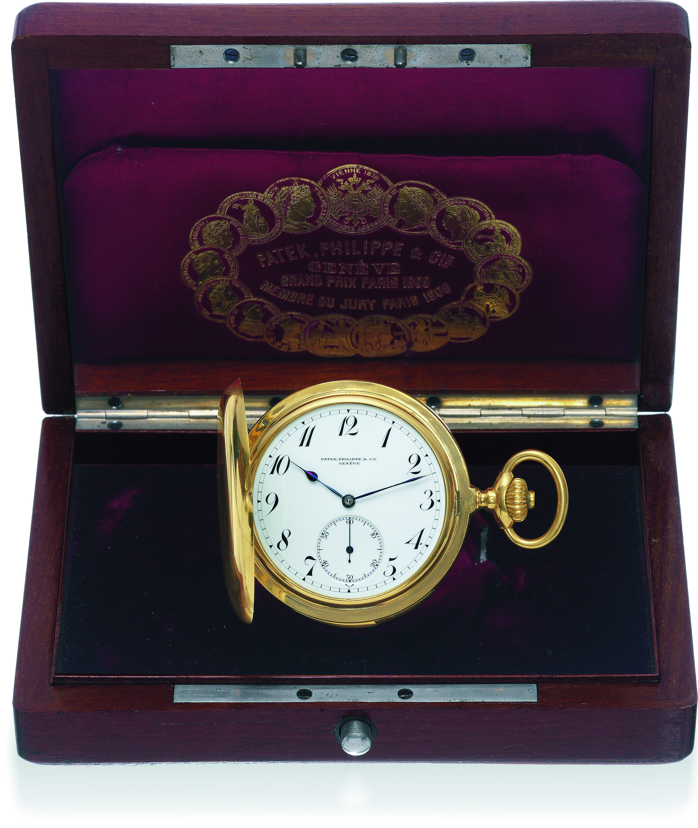 Minute-Repeater with Original Box and Copy of
Certificate
Patek Philippe & Cie, Genève, No. 156929, case No. 265286.
Made in 1910, sold on May 3, 1911.
Extremely fine and rare, large, minute-repeating, 18K yellow
gold, hunting-cased pocket watch. Accompanied by the original
Patek Philippe mahogany fitted box, copy of the original Certificate
of Origin, Extract from the Archives and spare mainsprings.