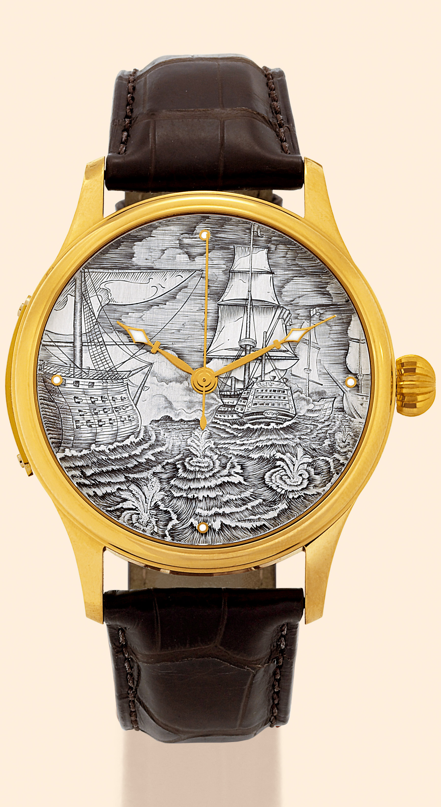 ?Trafalgar 1805?
RGM Watch Company, Lancaster in Pennsylvania, "Trafalgar 1805 ? H. M. S. Victory", Ref. 200. Made in 2005 to
commemorate the 200th anniversary of the Battle of Trafalgar. Part of a special commemorative series of watches
with hand-engraved dials depicting famous Tall Ships.
Very fine and rare, center-seconds, self-winding, water-resistant, 18K yellow gold gentleman?s wristwatch with a unique dial,
especially decorated movement and an 18K yellow gold RGM buckle. Accompanied