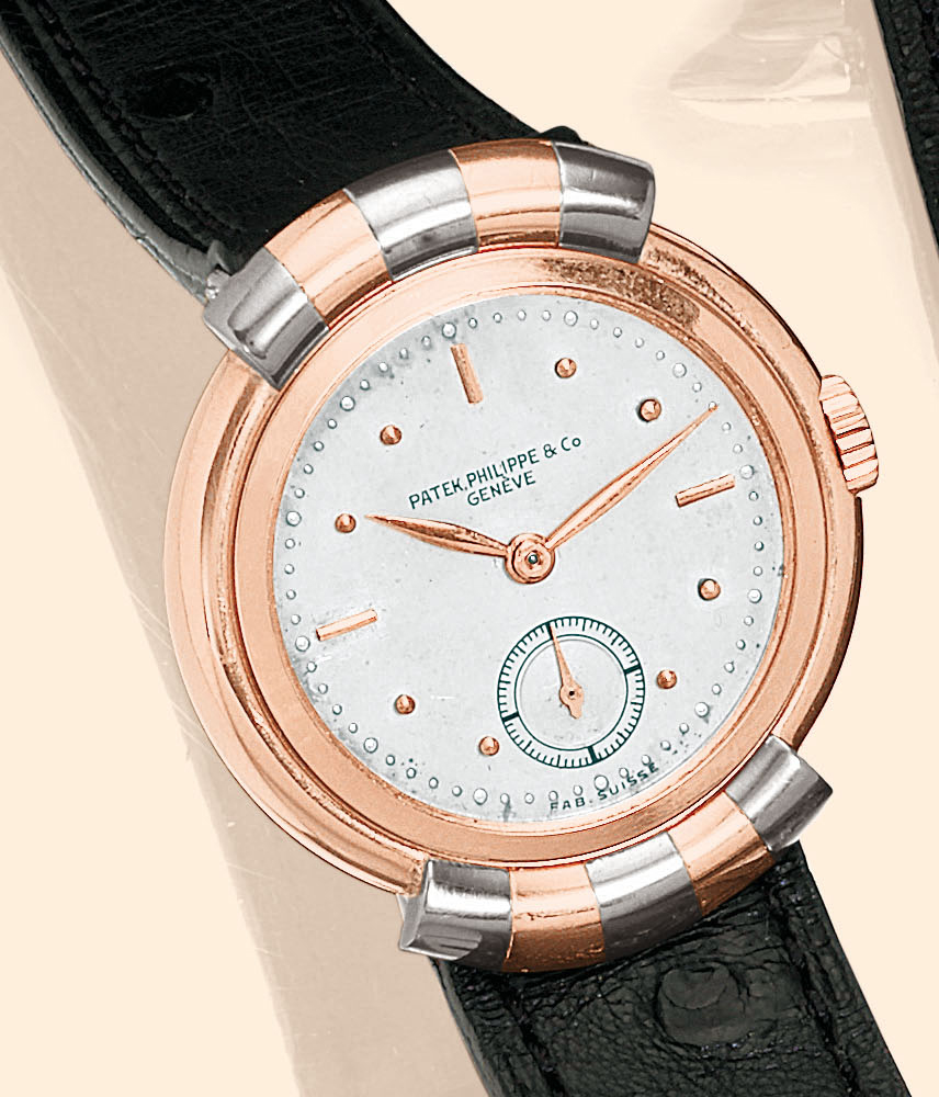 ?Two-Tone Hooded Lugs?
Patek Philippe & Co., Genève, No. 822712, case No. 505406. Sold on September 9, 1938.
Very fine and elegant, 18K pink gold and platinum gentleman?s Art Deco wristwatch with hooded lugs.