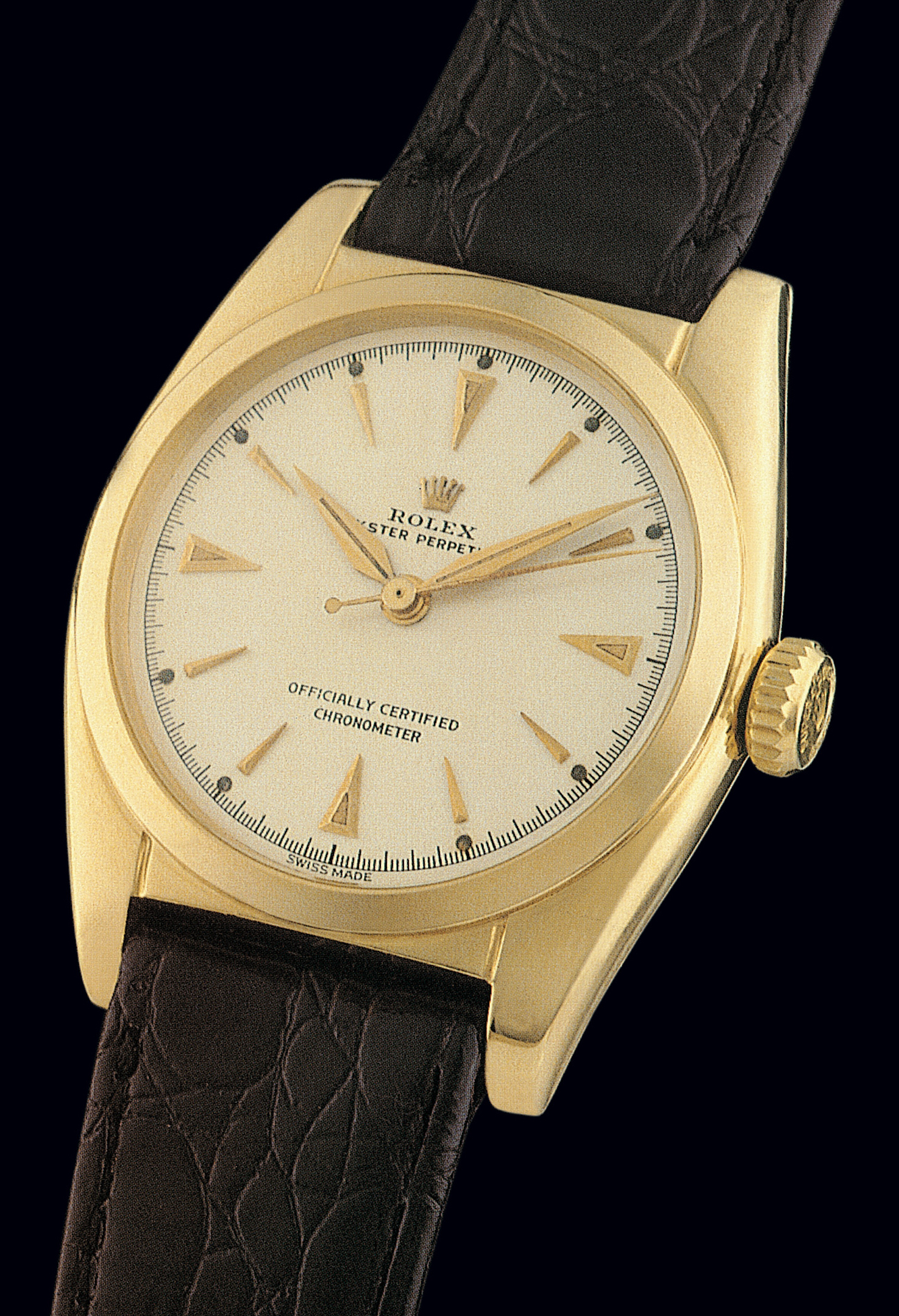 Ref. 6050,
So-Called ?Bubble-Back?
Rolex, ?Oyster Perpetual, Officially
Certified, Chronometer?, with ?Super-
Oyster? winding crown, Ref. 6050. Case No. 704326.
Made in 1950.
Fine and rare, tonneau-shaped, center seconds, selfwinding,
18K yellow gold gentleman's wristwatch
with gold plated Rolex buckle.