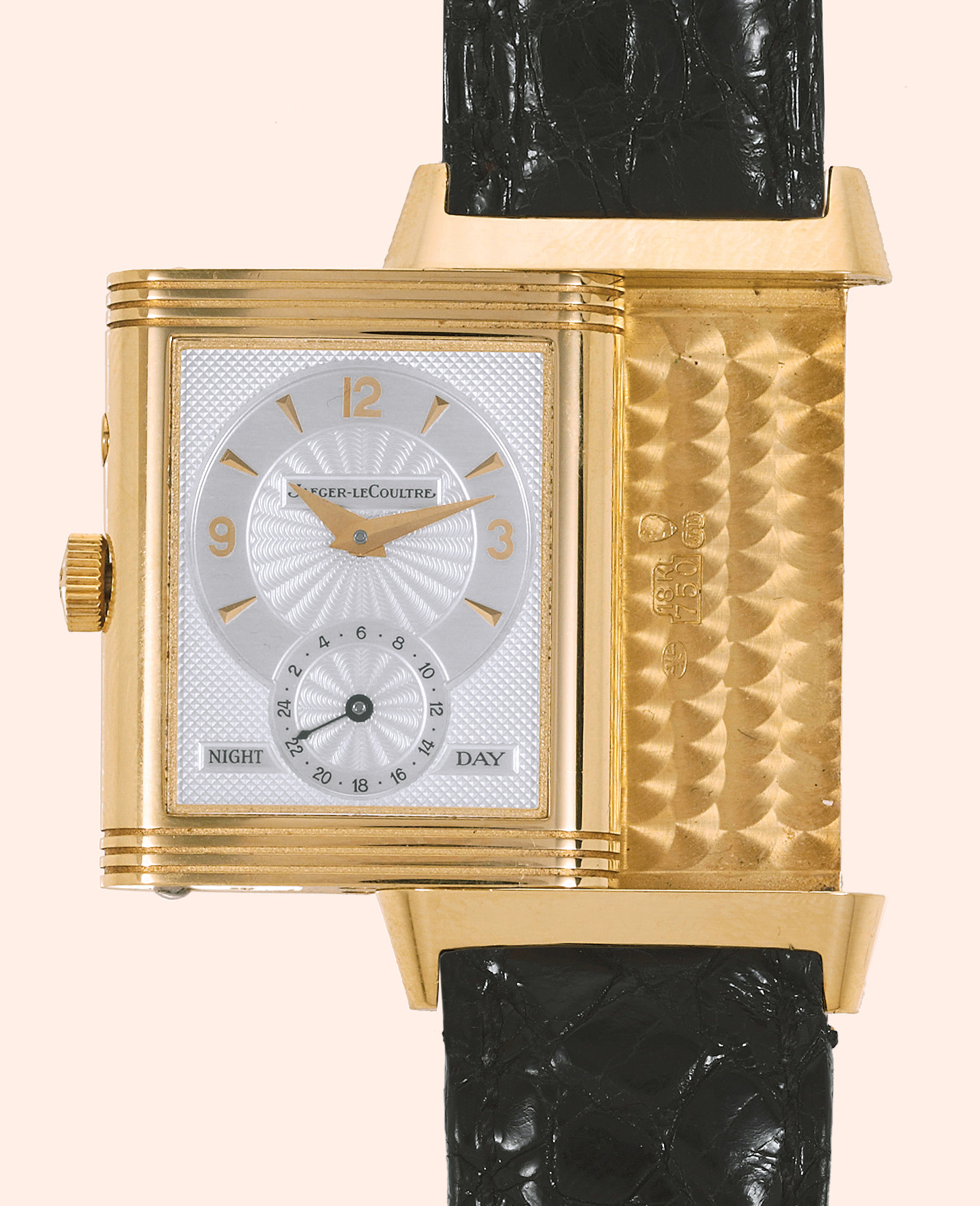 ?Day-Night"
Jaeger LeCoultre, "Reverso
Duoface Day-
Night", Ref. 270.1.54. Produced in the
1990s.
Very fine, rectangular, two time zone,
double-dial, 18K yellow gold gentleman's
wristwatch with an 18K yellow gold Jaeger
LeCoultre deployant clasp.