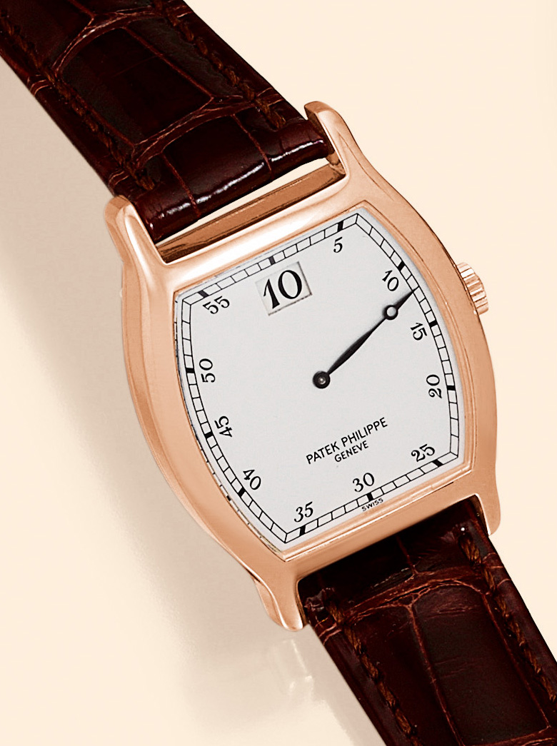 "150th Anniversary  Jumping Hour Watch" Patek Philippe & Cie, Genève, No. 752610, Ref. 3969. Made in a limited edition of 450 examples in 18K pink gold in 1989 to celebrate the 150th anniversary of Patek Philippe. Very fine and rare, tonneau-shaped, jump-hour, 18K pink gold gentleman's wristwatch with an 18K pink gold Patek Philippe buckle. Accompanied by a fitted box and Certificate of Origin.