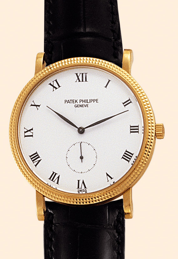 Patek Philippe, Genève, ?Calatrava,?  No. 1818779, case No. 2873413, Ref. 3919. Made in the 1990s. Fine and elegant, flat, 18K yellow gold gentleman's wristwatch with an 18K yellow gold Patek Philippe buckle.