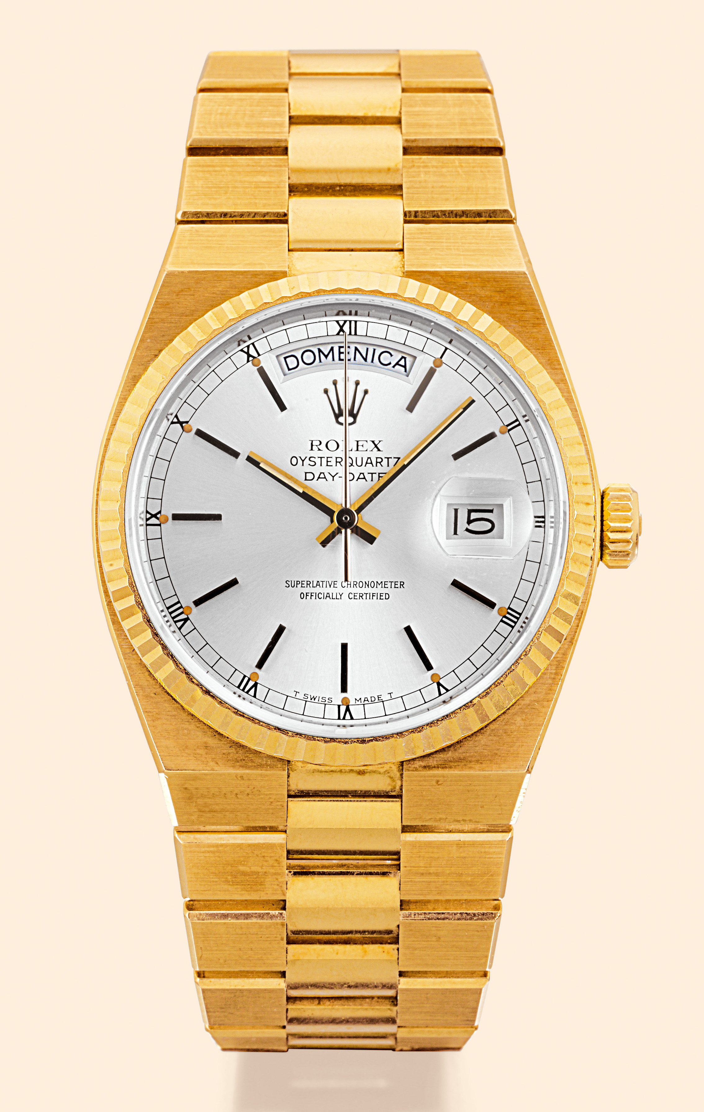 ?Oysterquartz?  Rolex Oysterquartz "Day-Date", Superlative Chronometer Officially Certified, Ref. 19018. Made in 1976. Fine tonneau-shaped, water-resistant, center-seconds, 18K yellow gold gentleman's quartz wristwatch with day/ date and an 18K polished and brushed yellow gold integrated bracelet with concealed deployant clasp. Accompanied by original box and certificate.