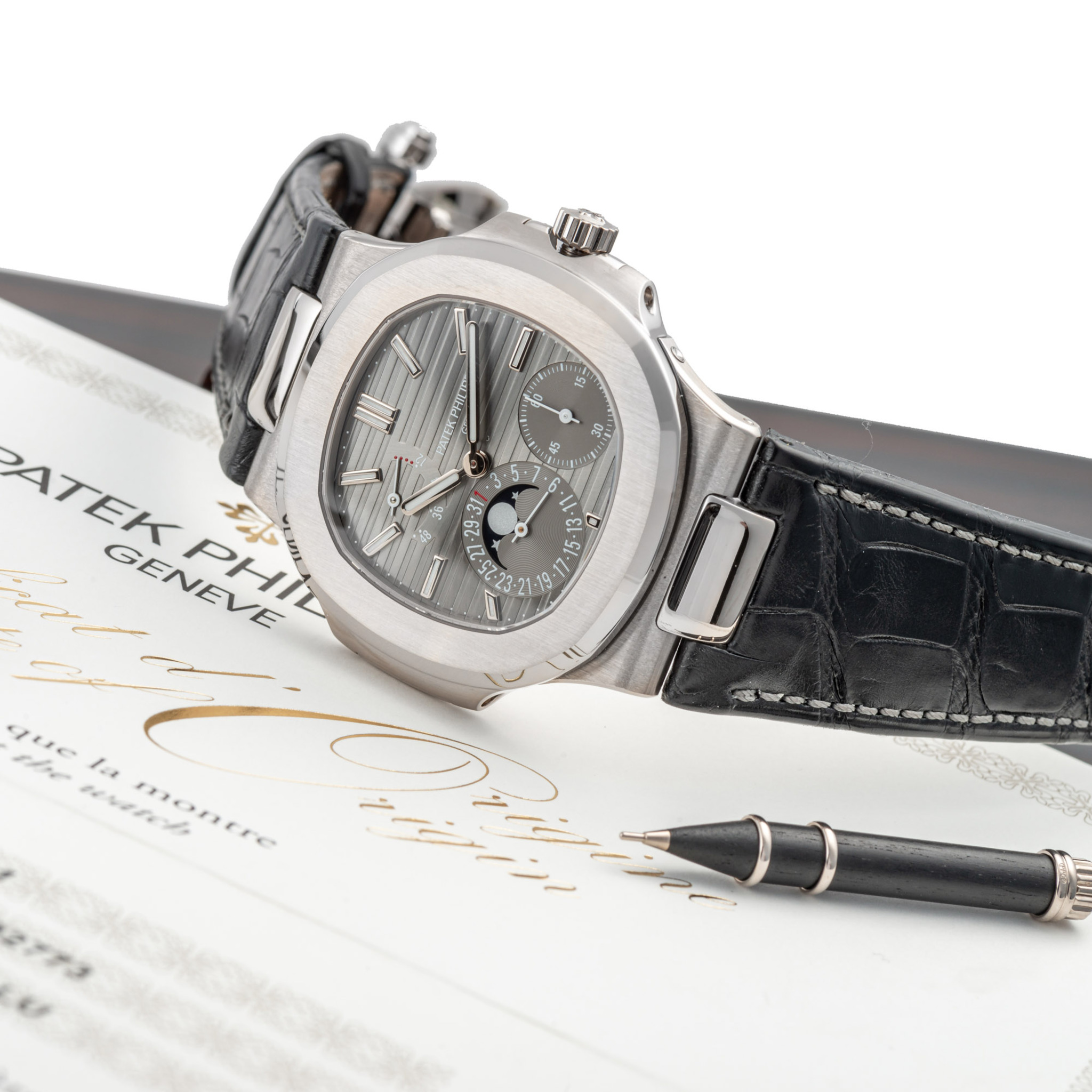 PATEK PHILIPPE, REF. 5712, NAUTILUS, DATE, POWER RESERVE AND MOONPHASE, WHITE GOLD