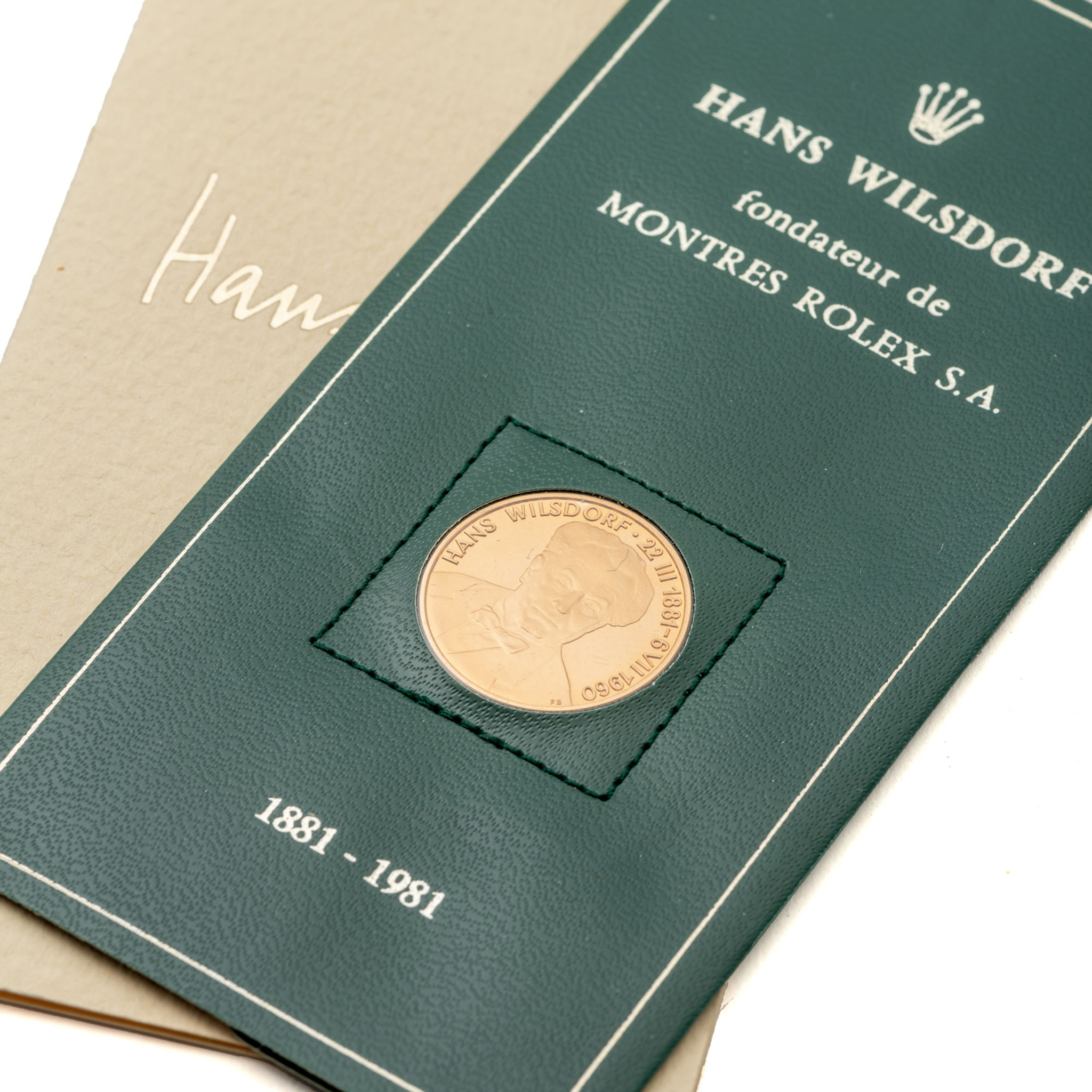 ROLEX, HANS WILSDORF BOOK AND GOLD COMMEMORATIVE COIN